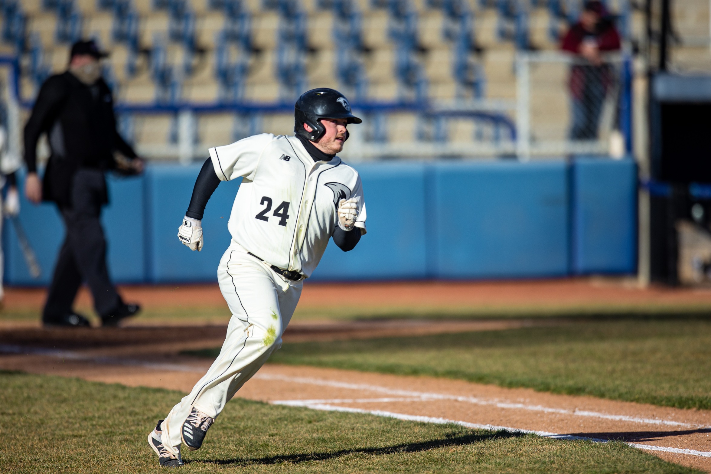 action photo of RC baseball player Hunter Andrews rounding first base