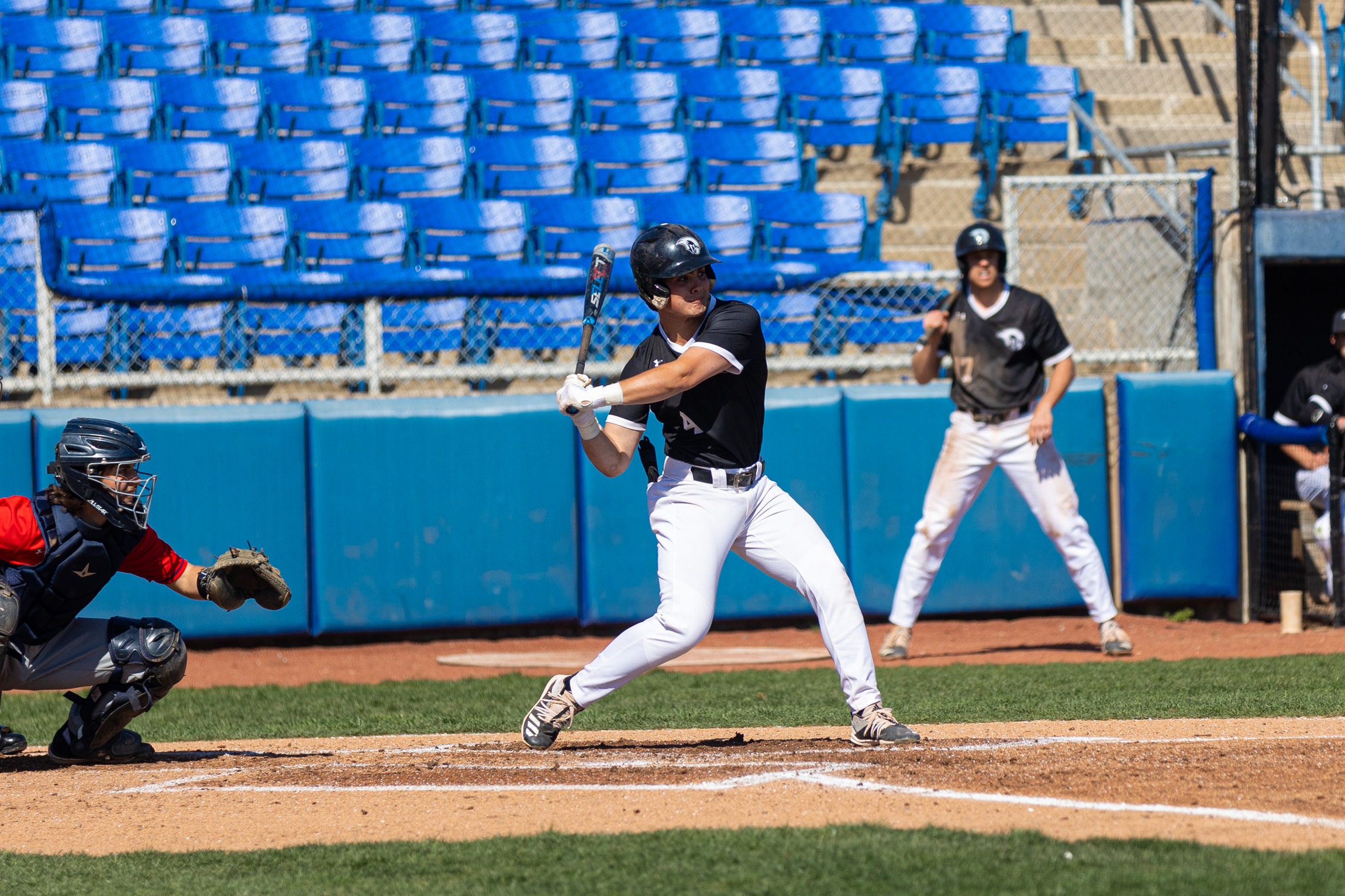 action photo of RC baseball player Carter Plunkett hitting