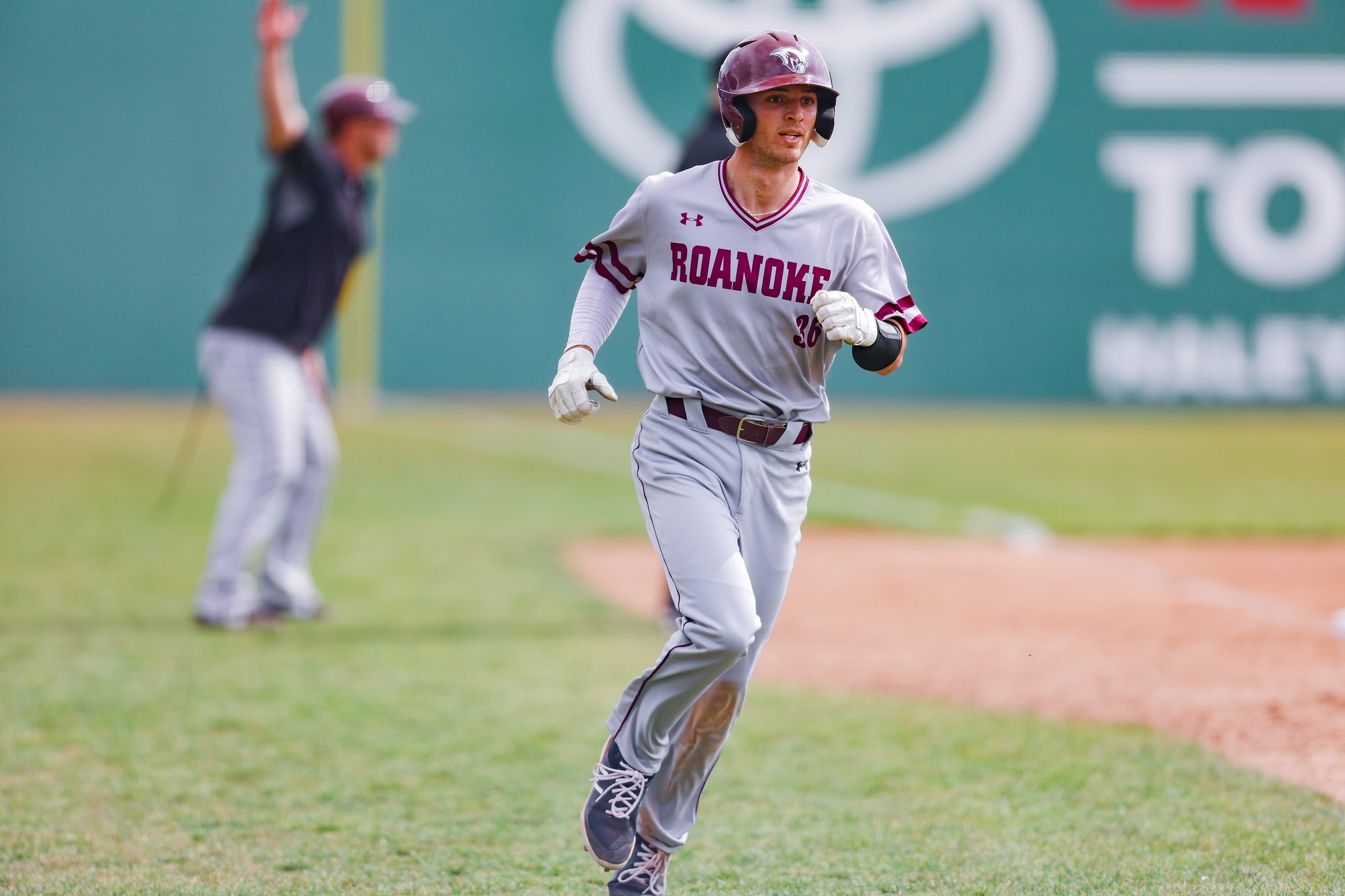 action photo of RC baseball player Jeb Byerley running home