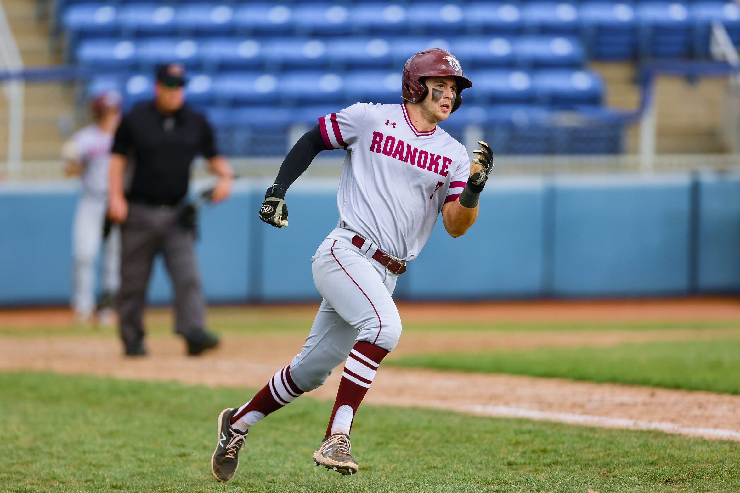 action photo of RC baseball player Mason Staz running the bases.