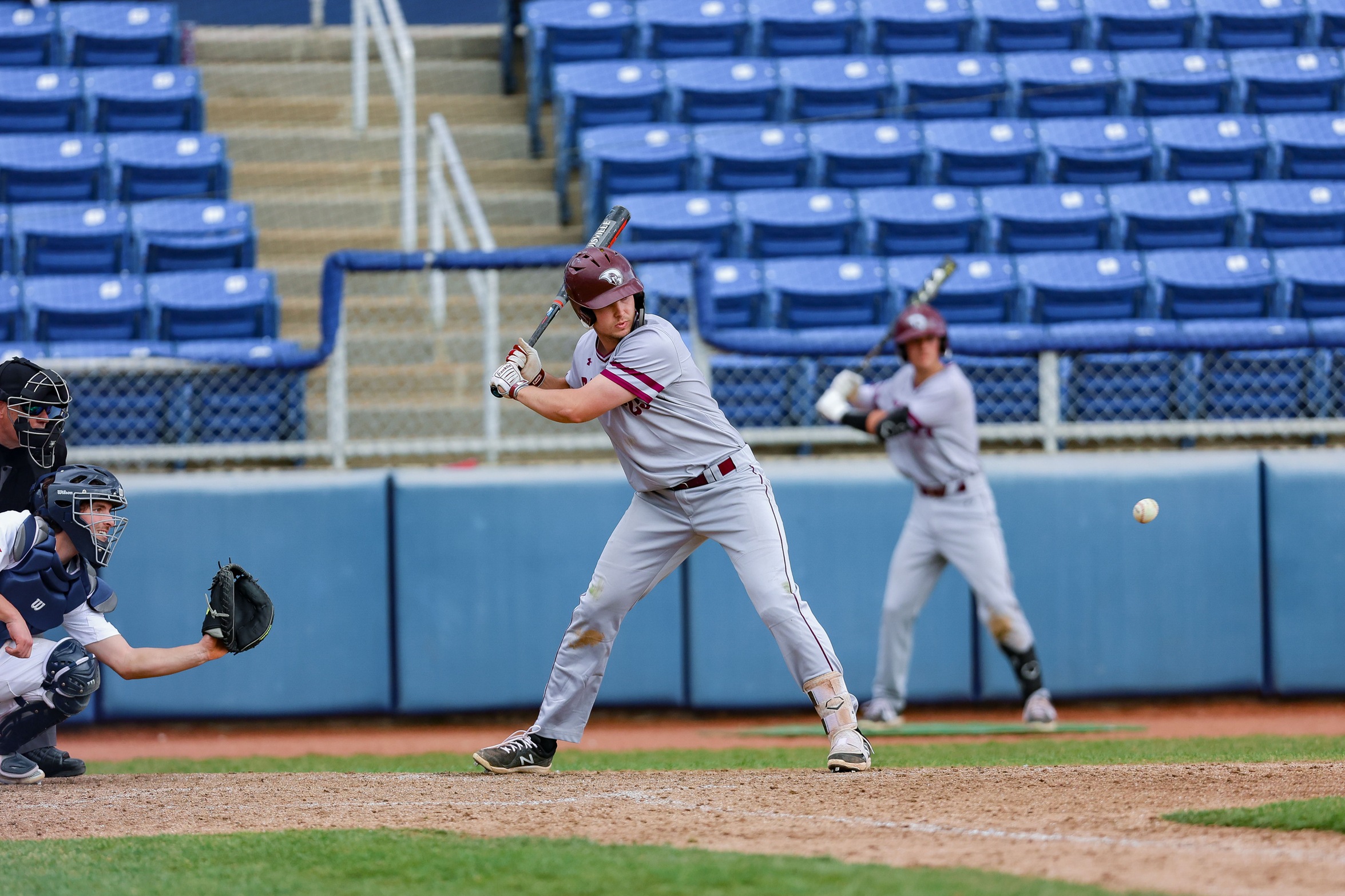 action photo of RC baseball player hitting