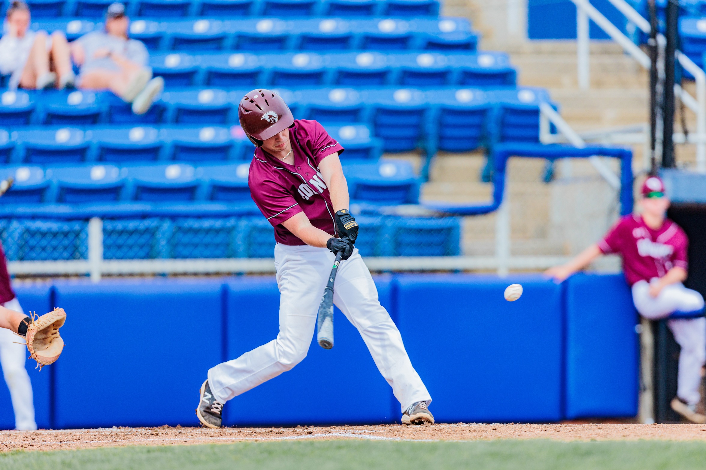 action photo of RC baseball player Troy Ferrell hitting