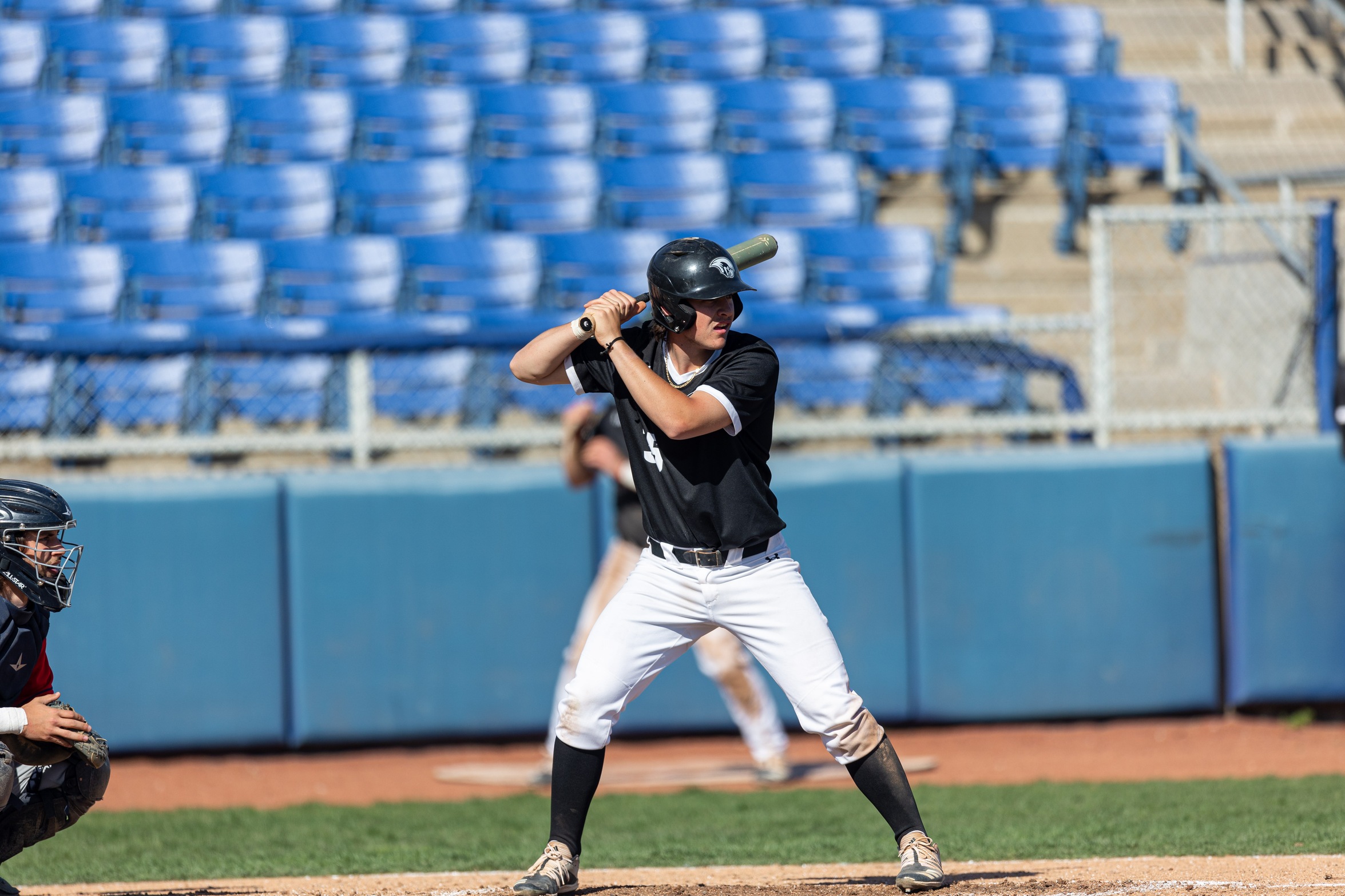 action photo of RC baseball player hitting