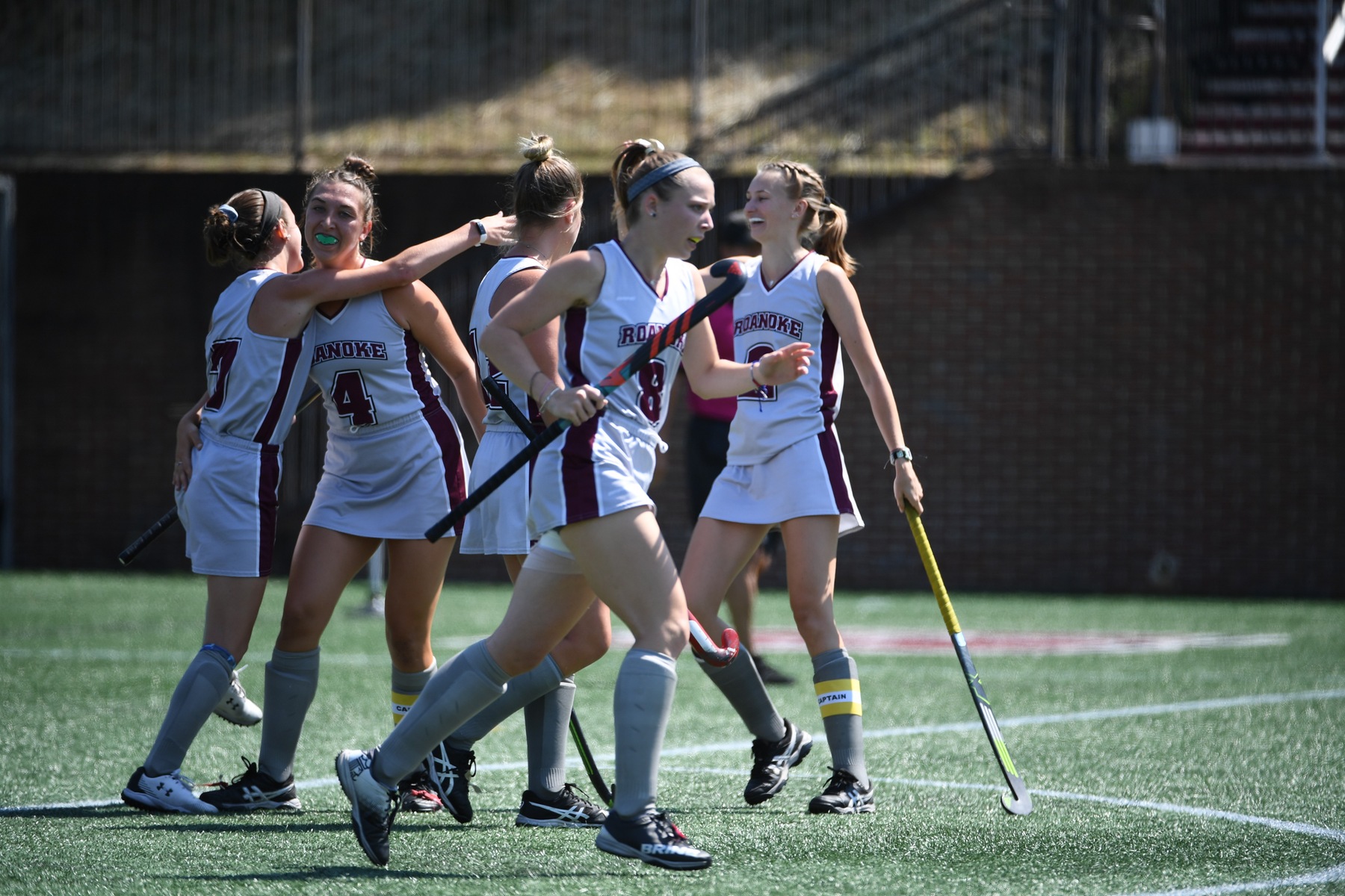 action photo to the Roanoke field hockey team celebrating a score
