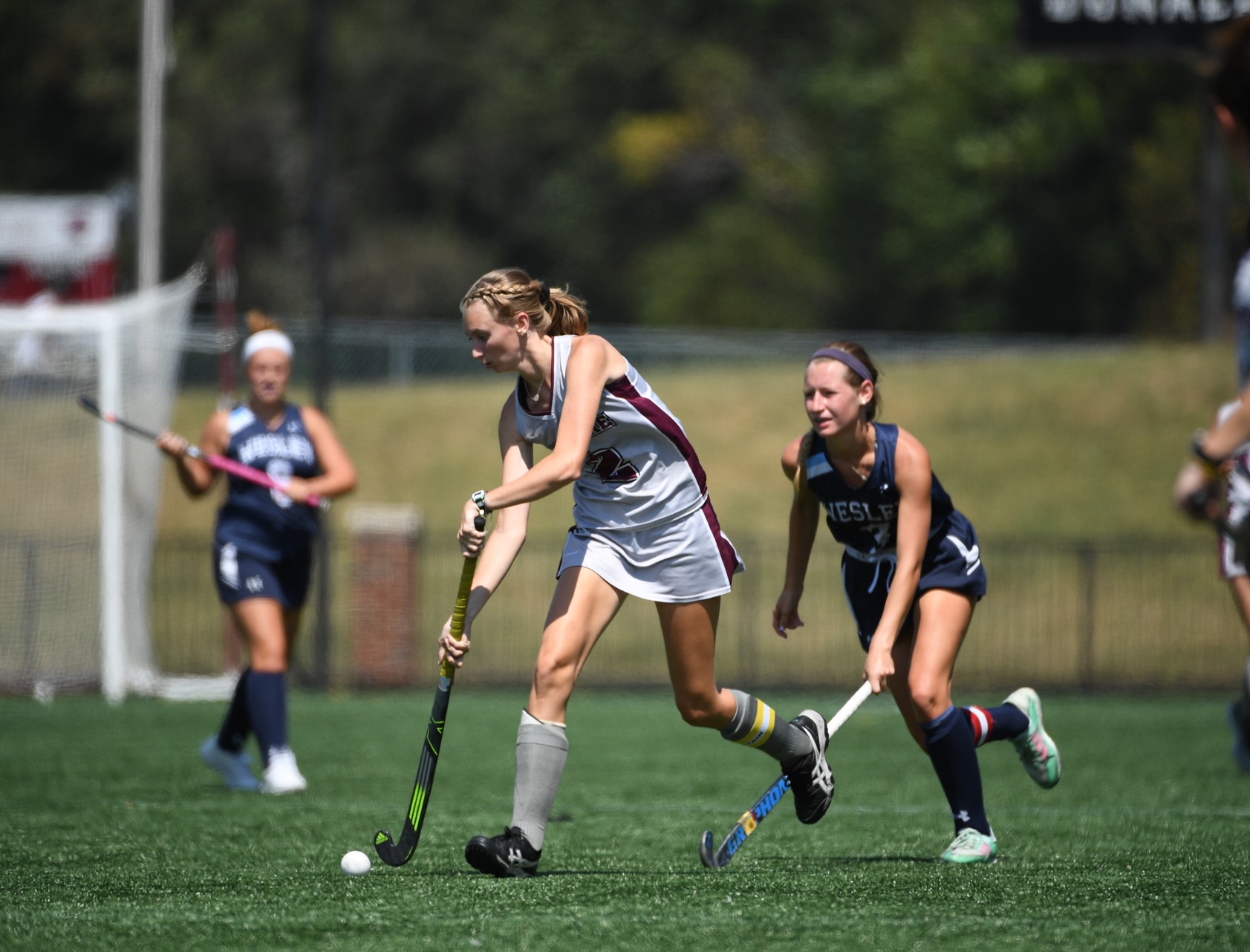 action photo of Emilee Wooten stick handling thru the defense