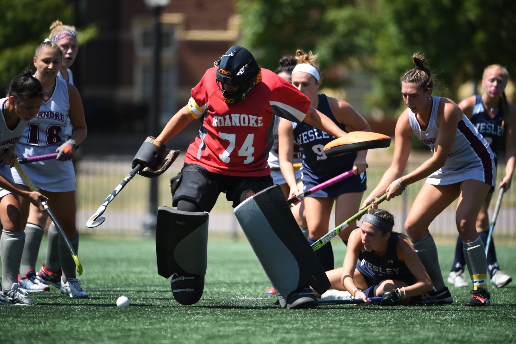 action photo of RC field hockey goalie Emma Clark