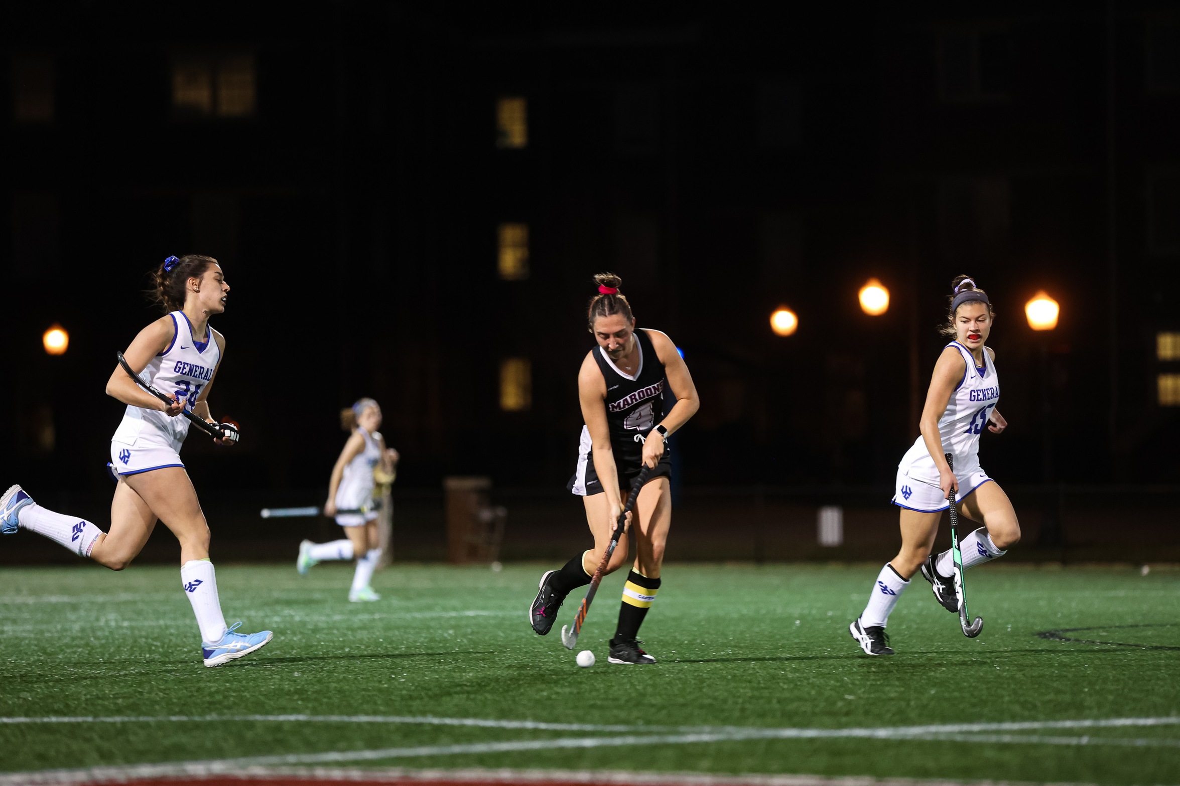 action photo of RC field hockey player Lauren Heffron