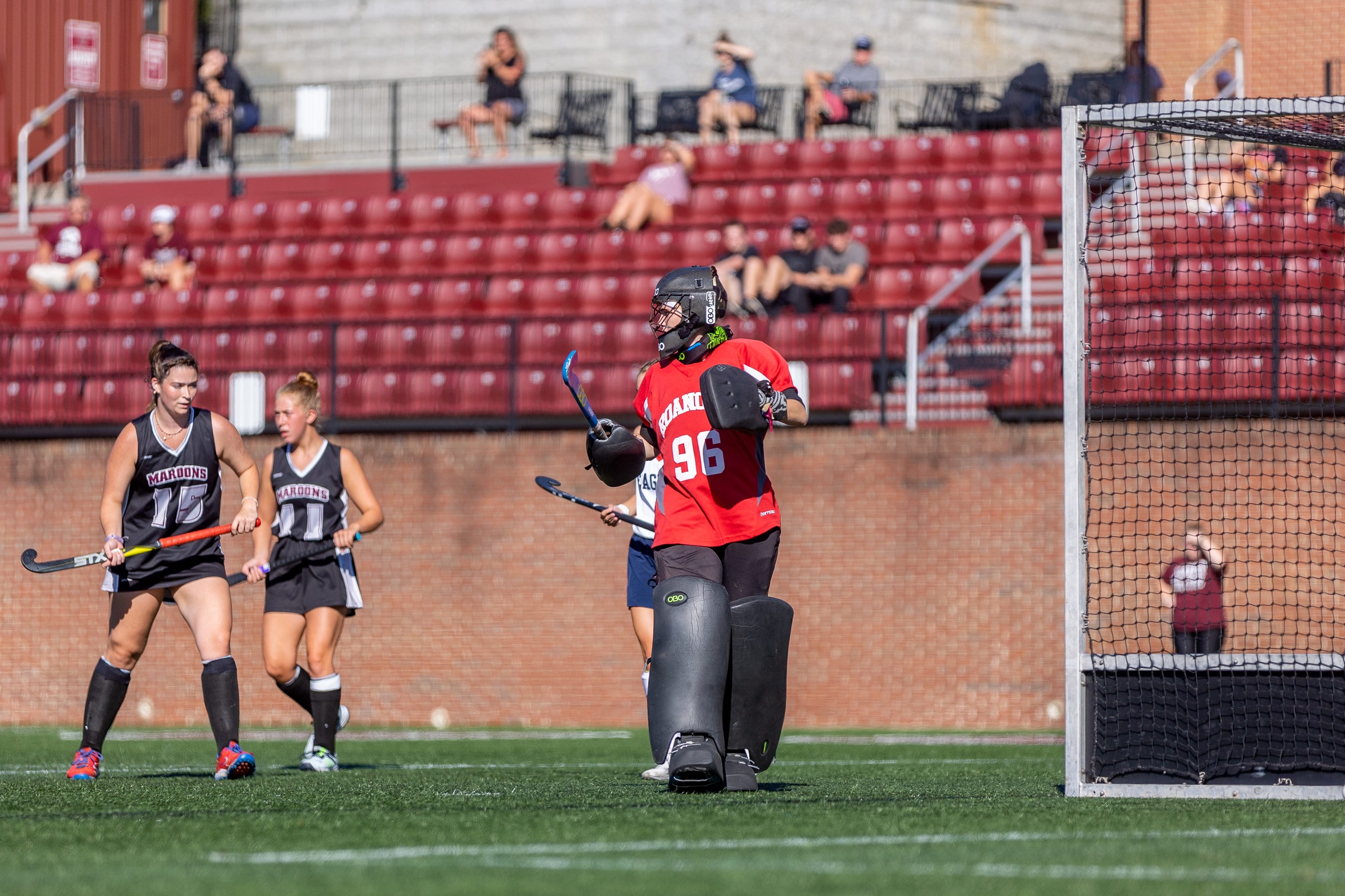 action photo of the back line of defense for the RC field hockey team