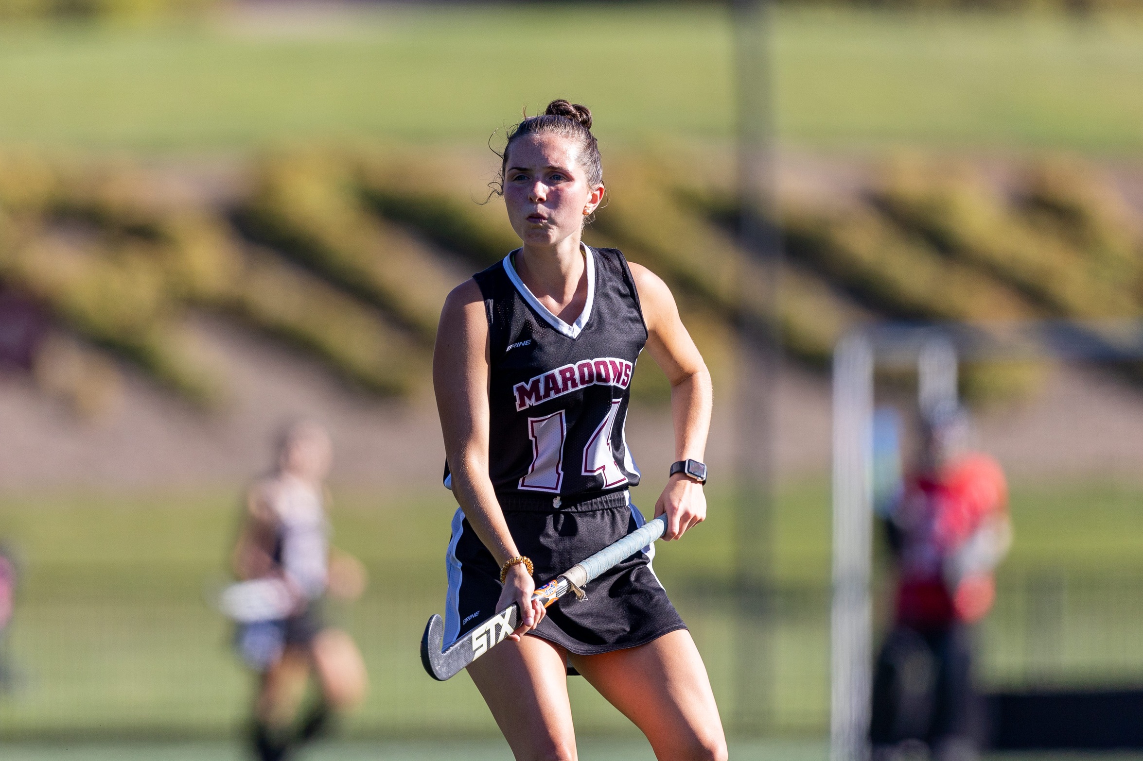 action photo of RC field hockey midfielder Caroline Diehl