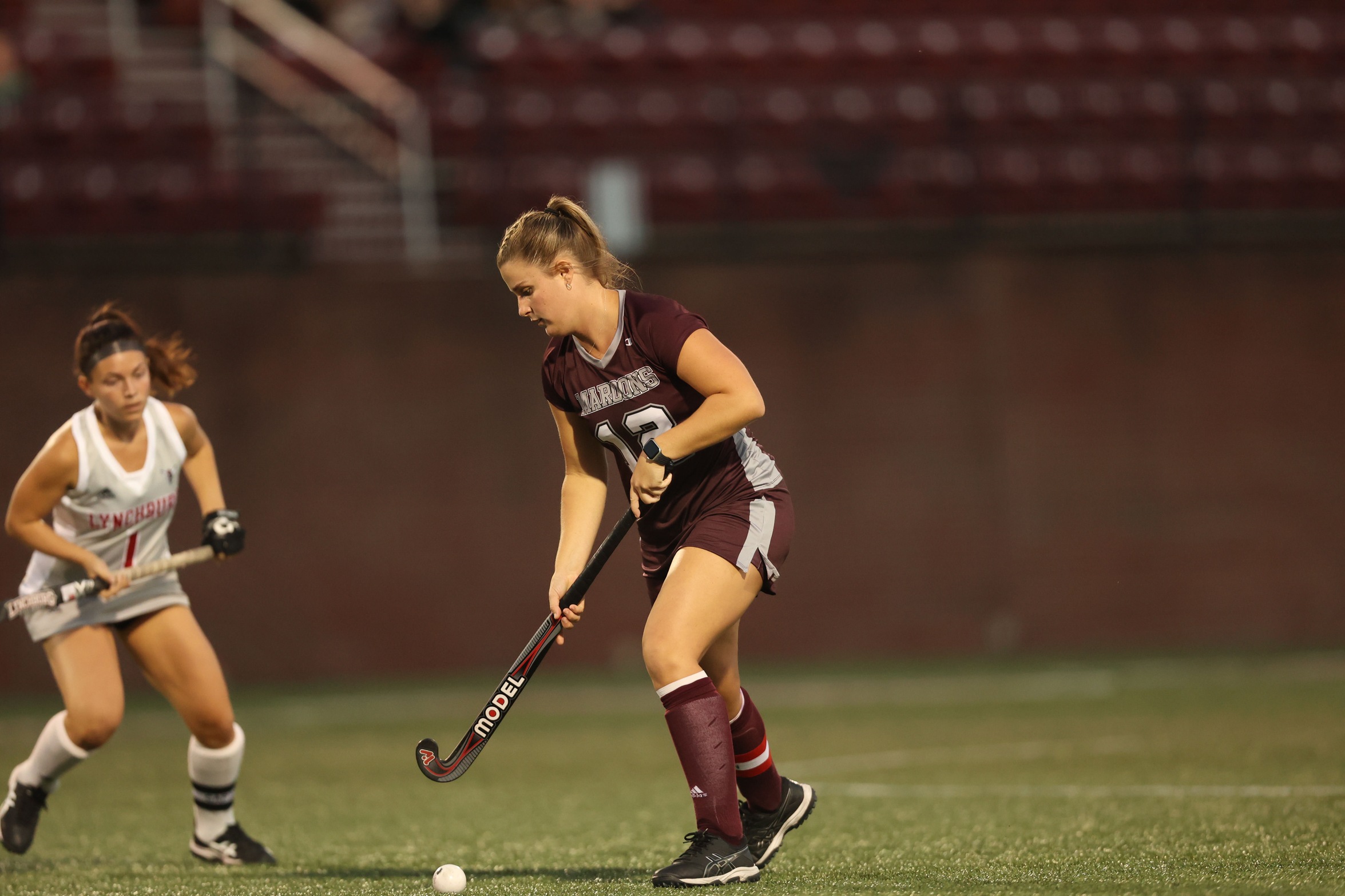 action photo of RC field hockey midfielder Claire Eisenhart