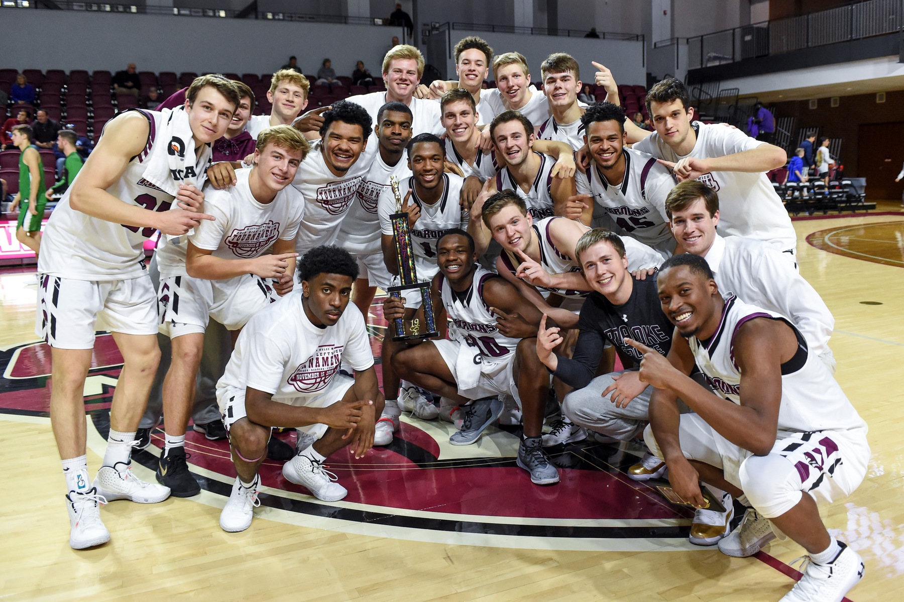 team photo with the trophy after winning a tournament