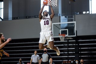 action photo of RC basketball player Efosa Edosomwan