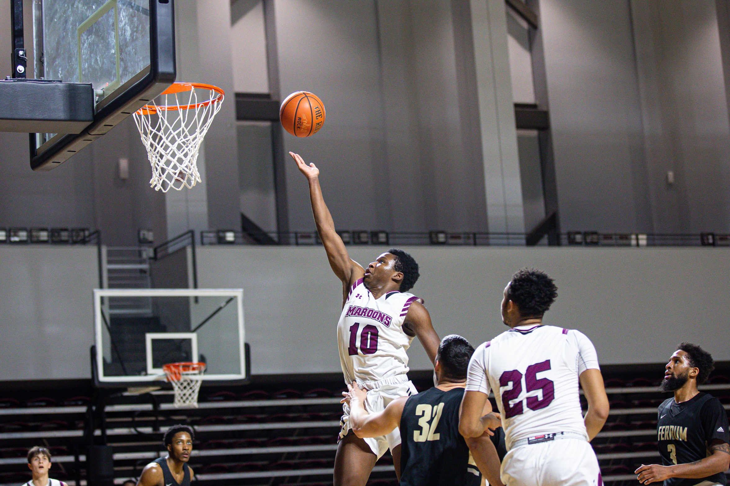 action photo of RC basketball player Efosa Edosomwan laying in the ball