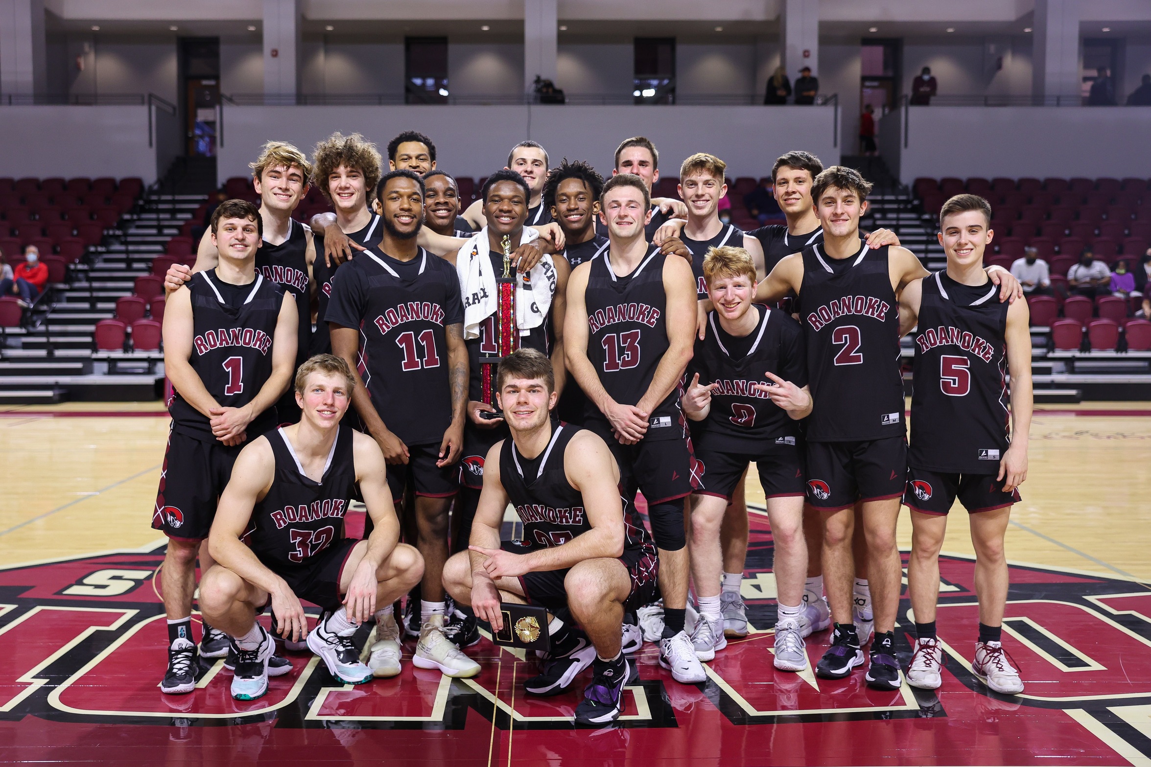 posed shot of RC men's basketball team after winning Cregger Invite Championship
