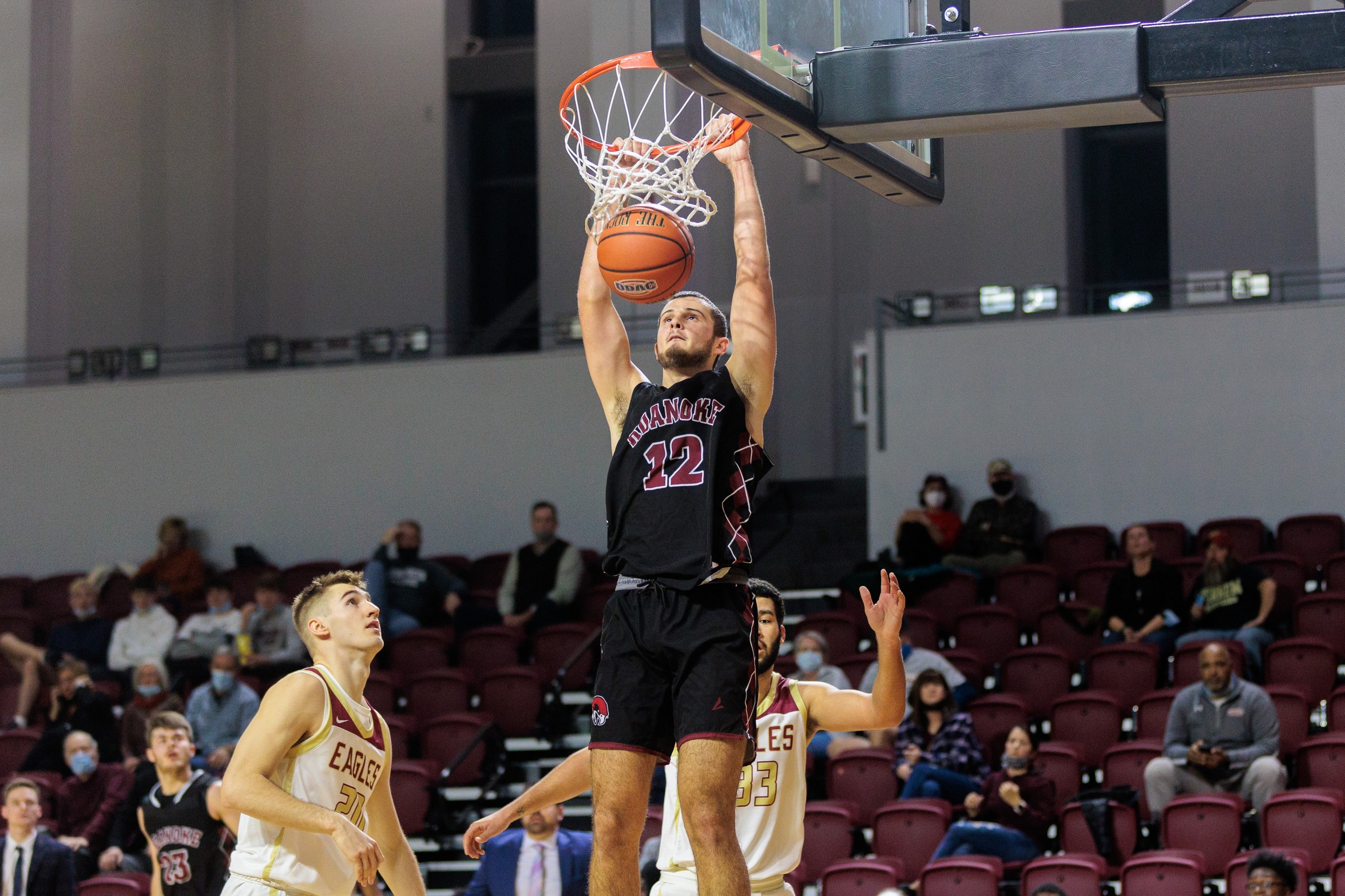 action photo of RC basketball player Justin Kuthan with a dunk