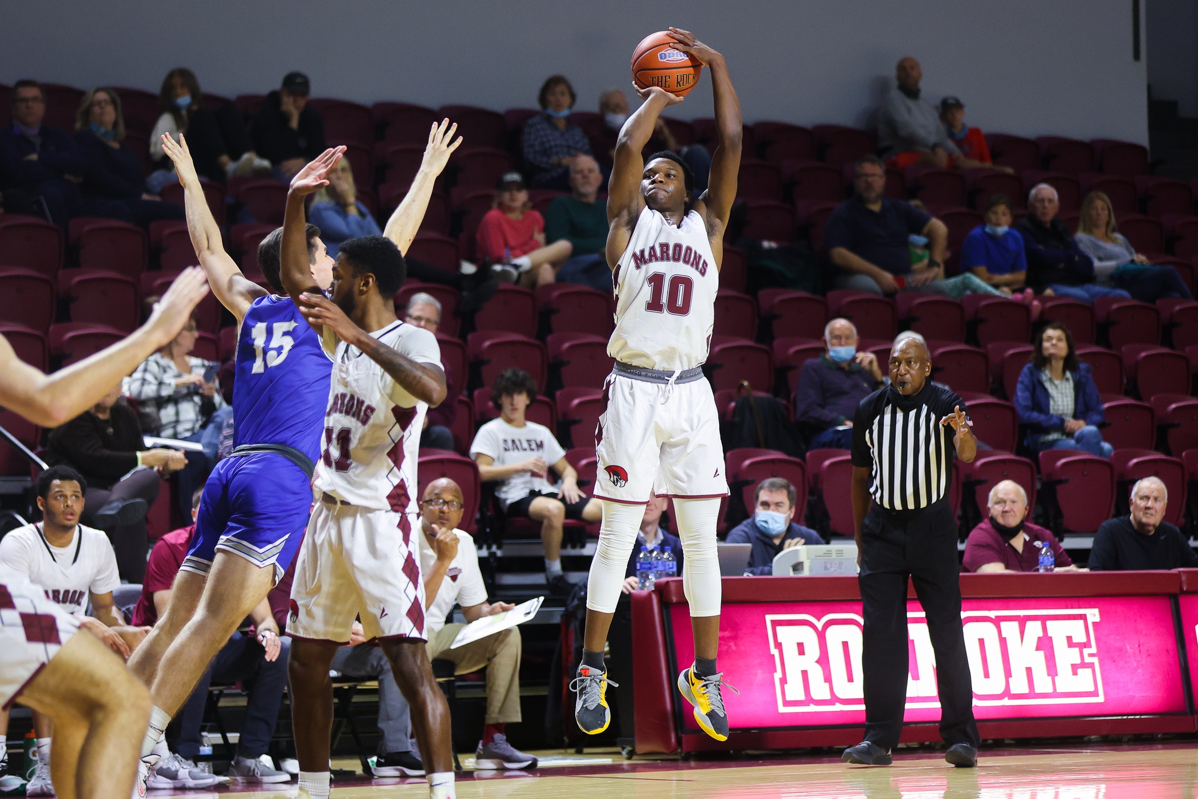 action shot of RC basketball player Efosa U-Edosomwan taking a jump shot