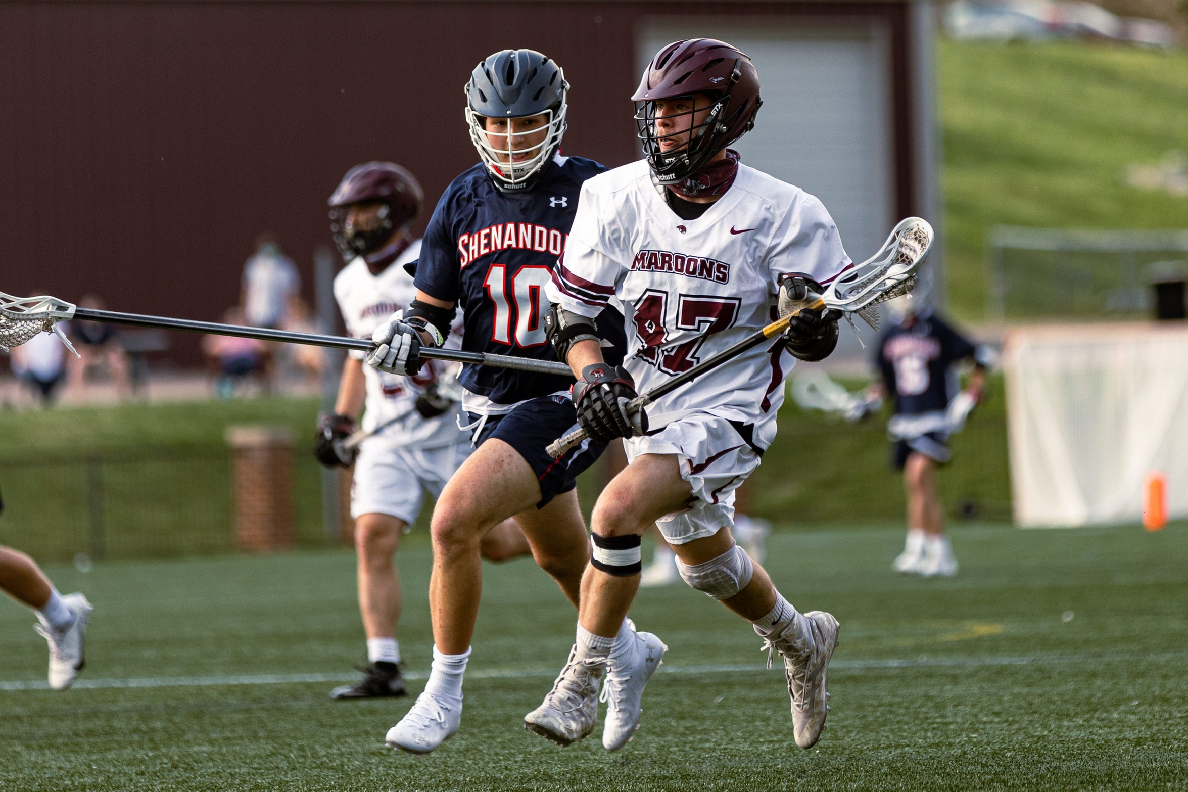 action photo of RC lacrosse faceoff specialist Austin Gambino