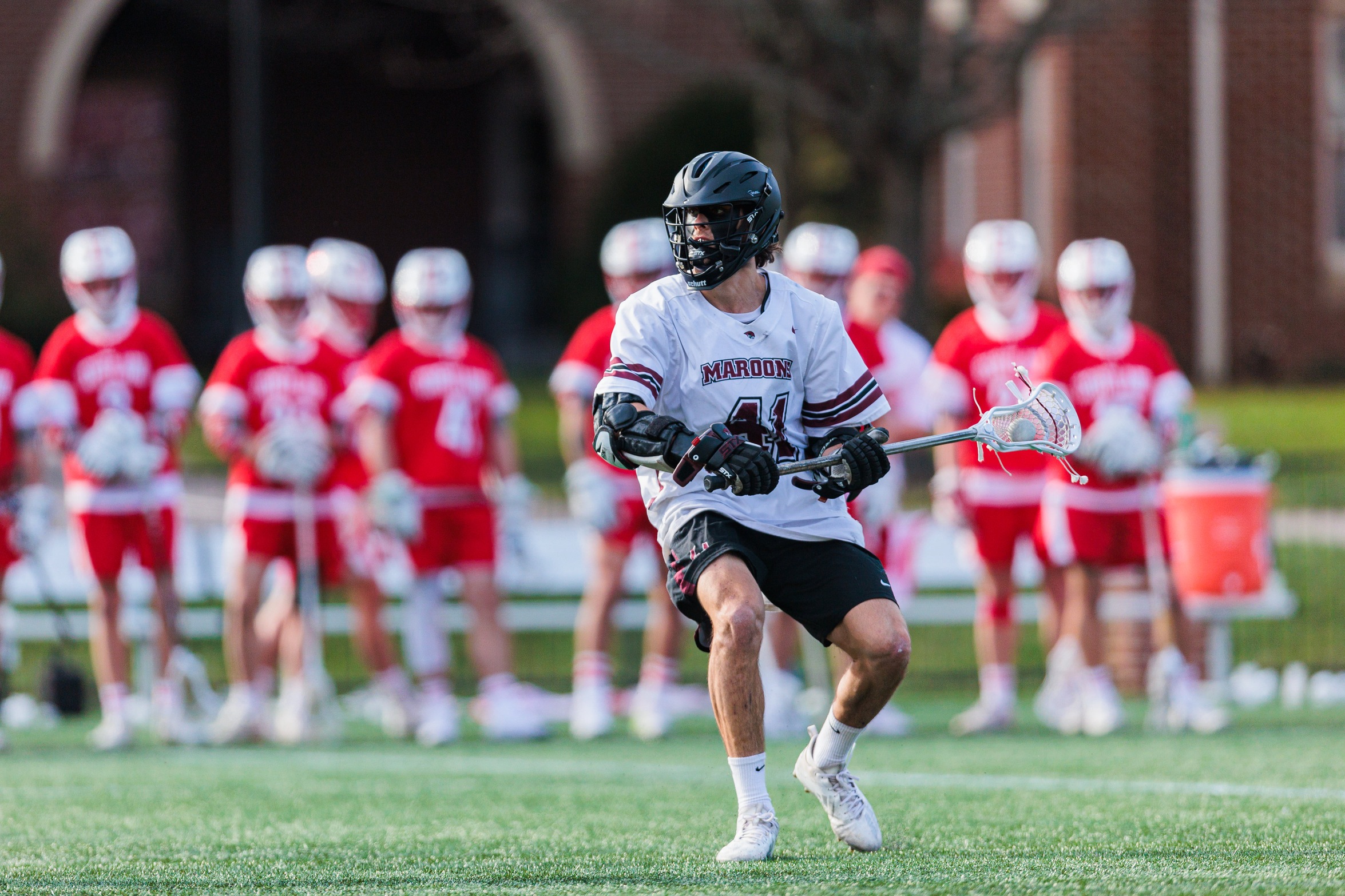 action photo of RC men's lax player Luke Kammerman
