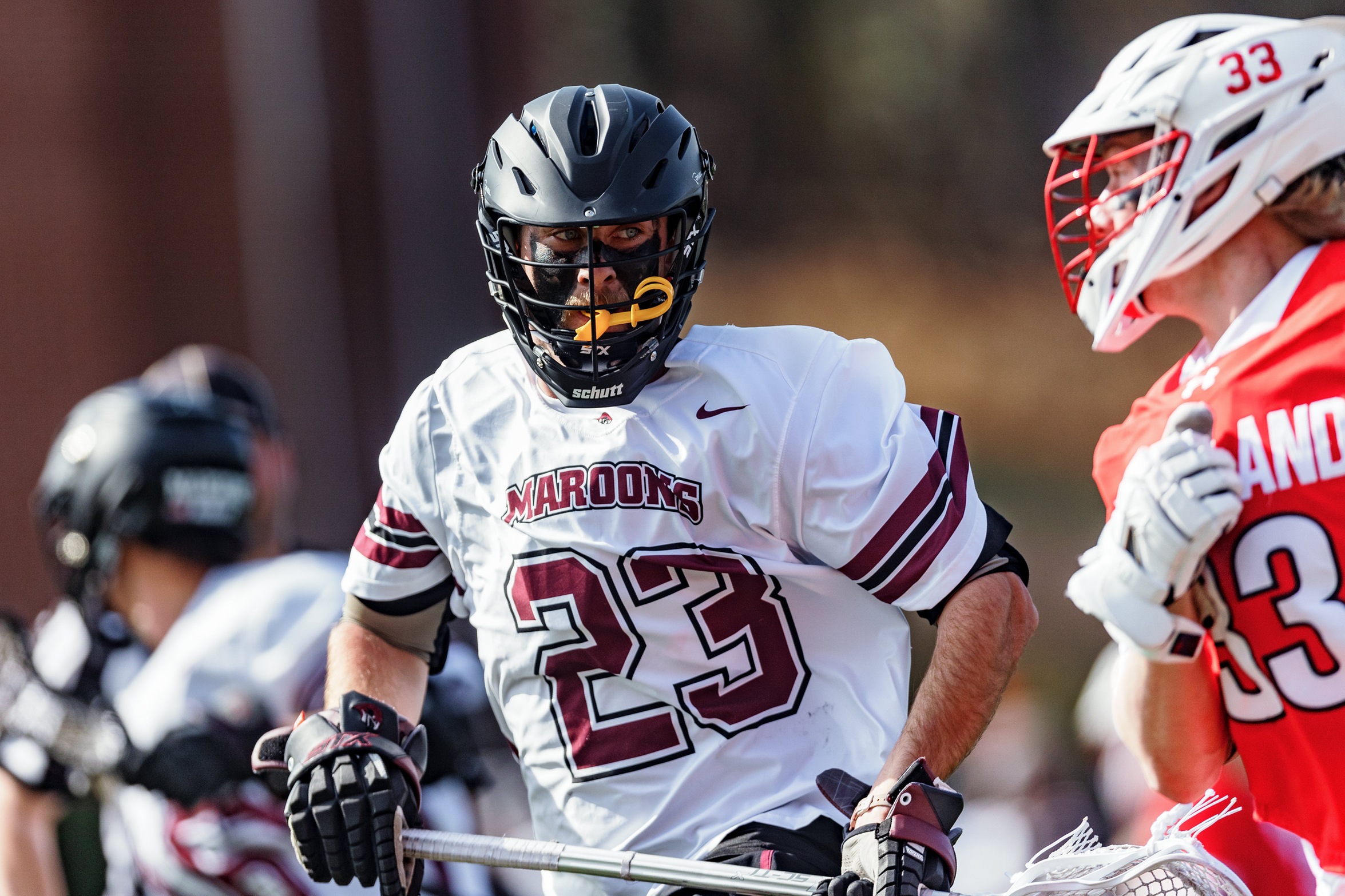 action photo of RC mlax player Griffin Buck on defense
