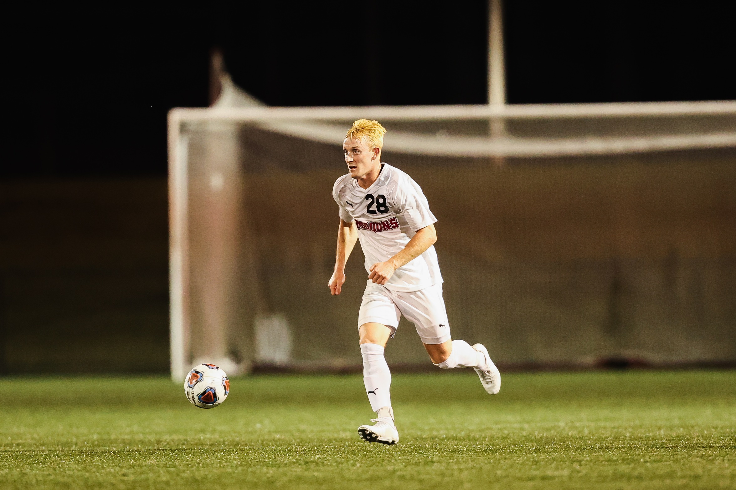 action photo of RC men's soccer player Nathan Carey
