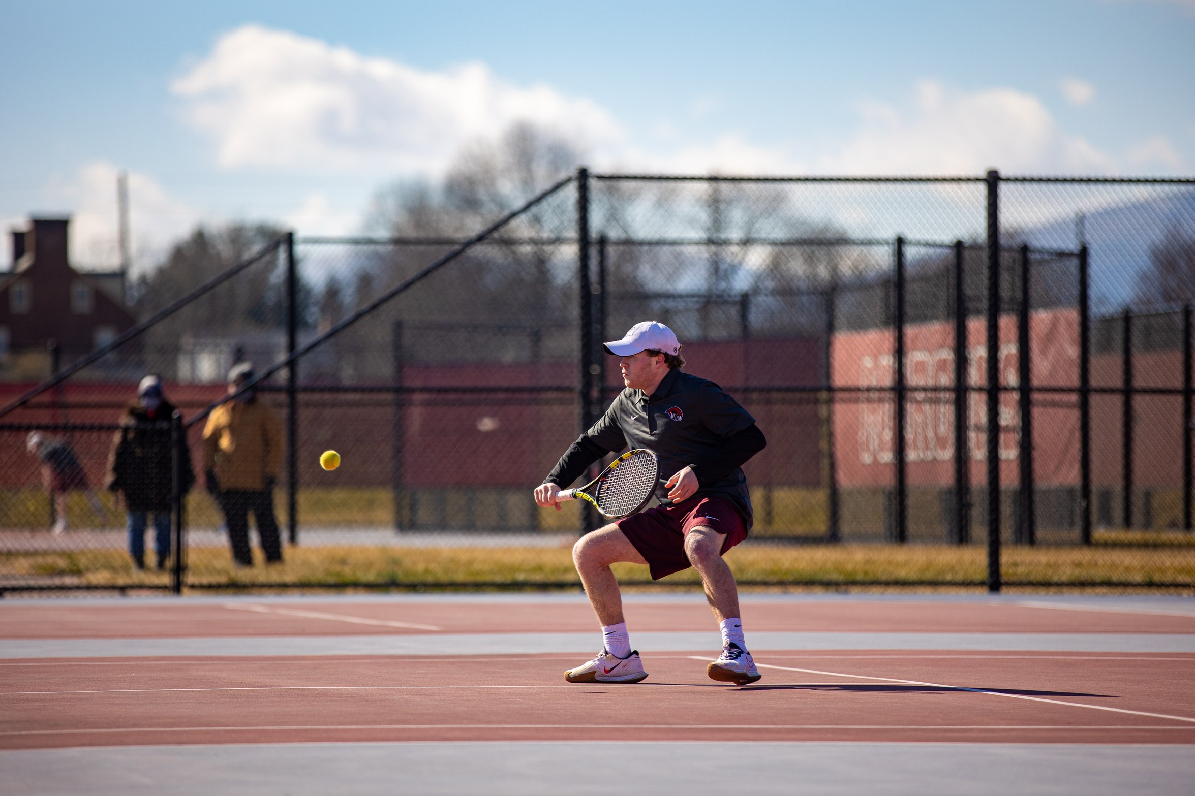 action photo of RC tennis player going to the net