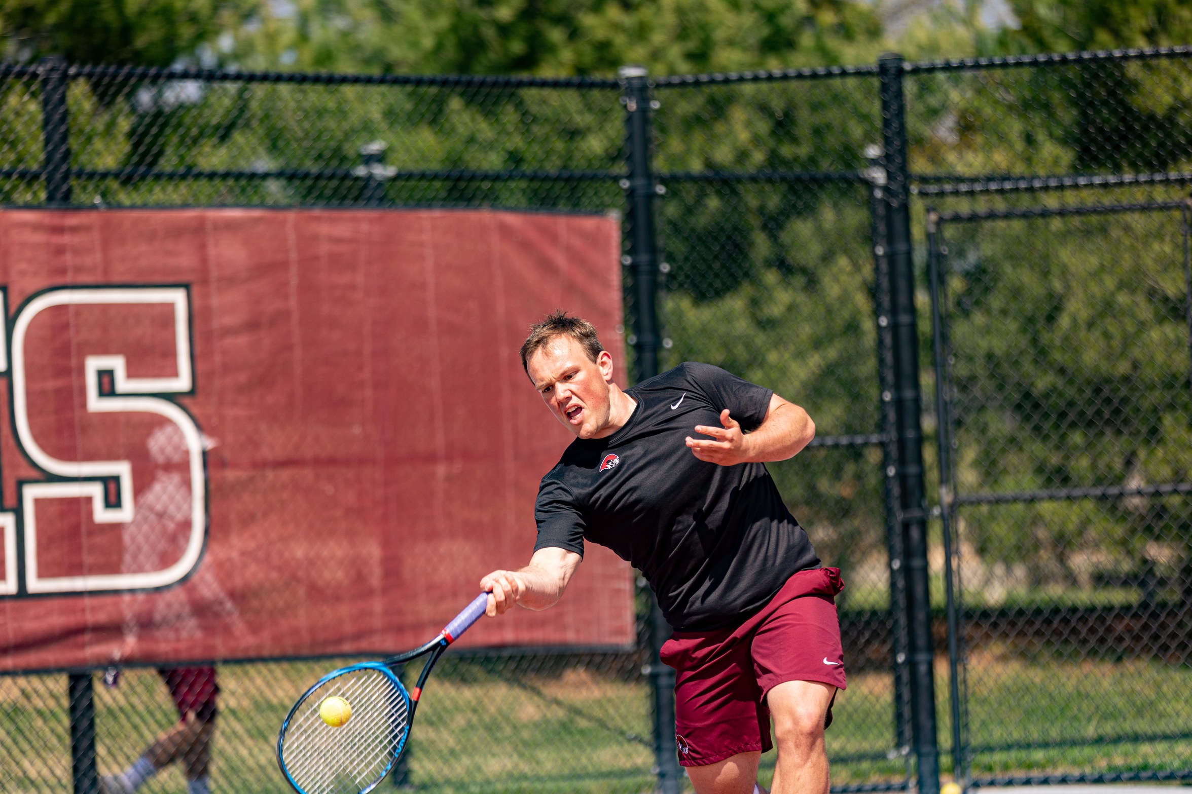 action photo of RC men's tennis player Jack Fishwick