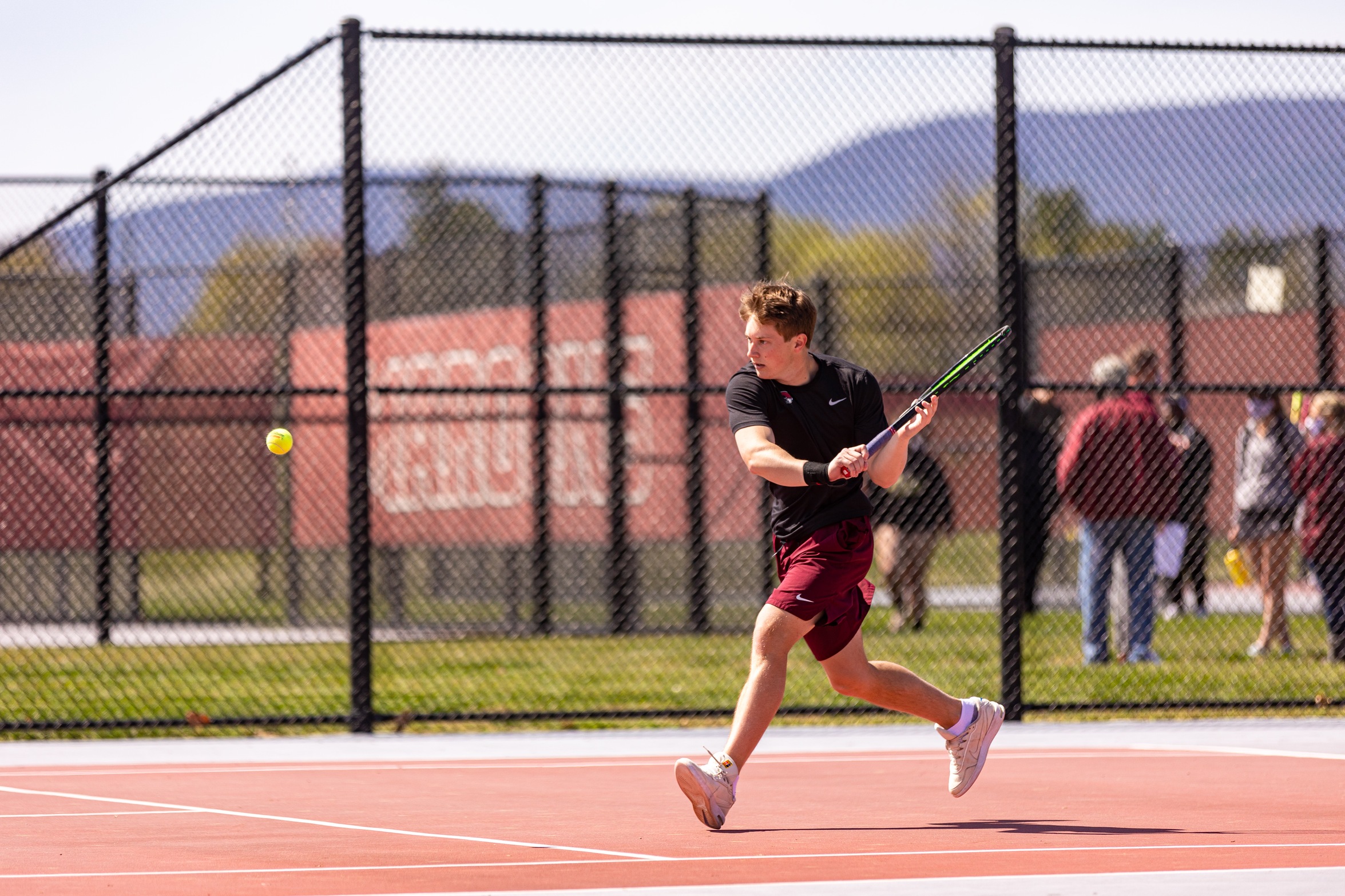 action photo of RC men's tennis player Dalton Capobianco