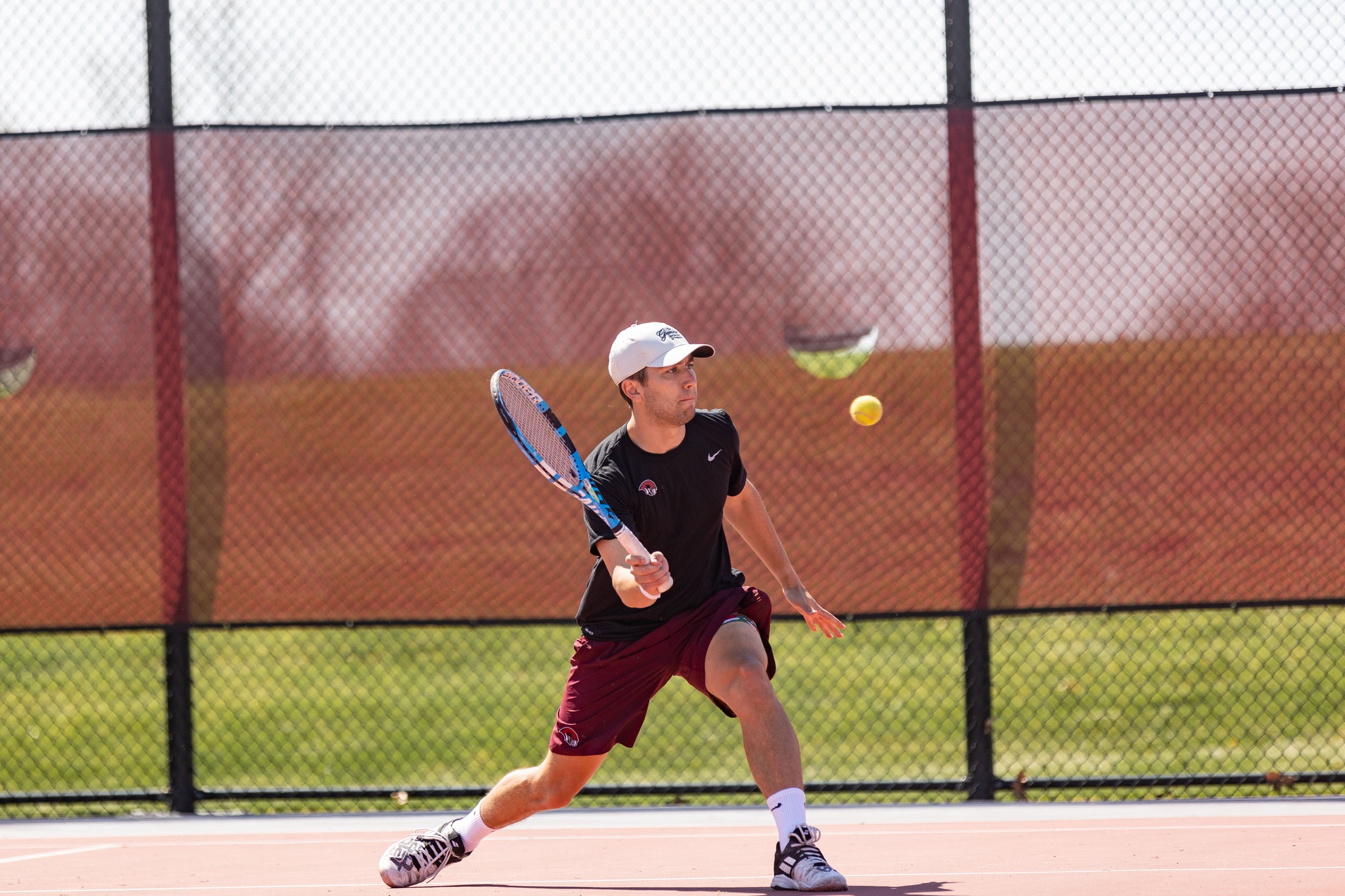 action photo of RC men's tennis player