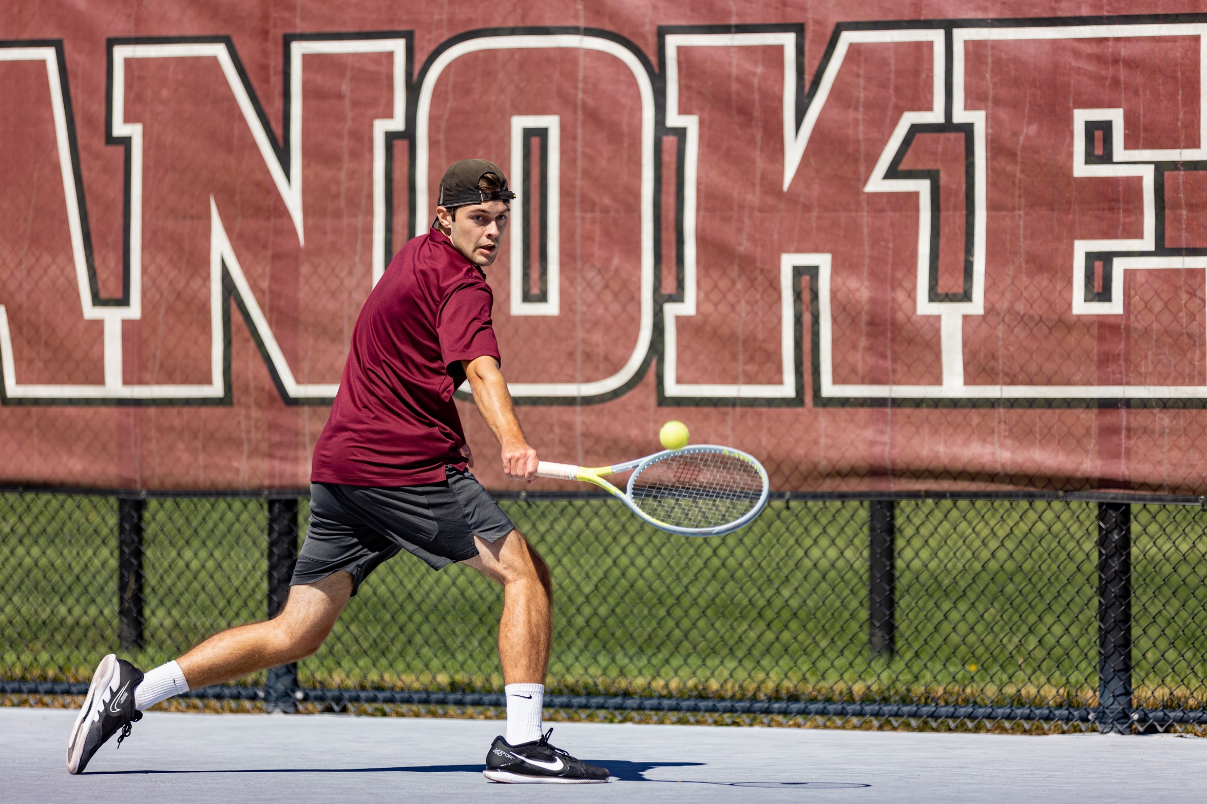 action photo of RC men's tennis
