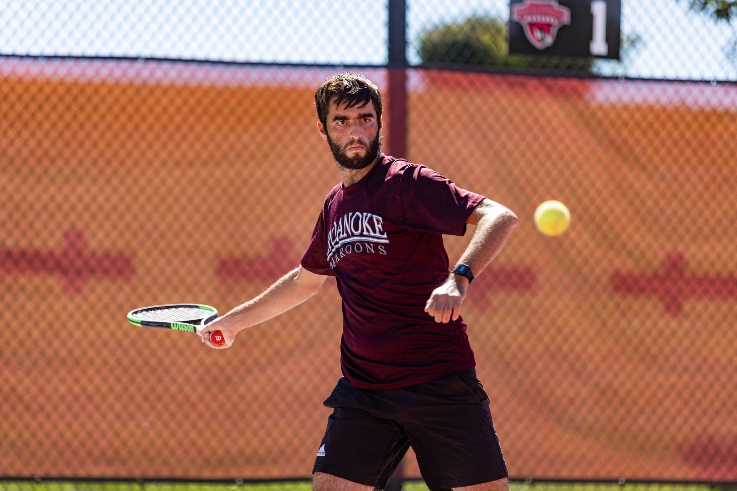 action photo of RC men's tennis player