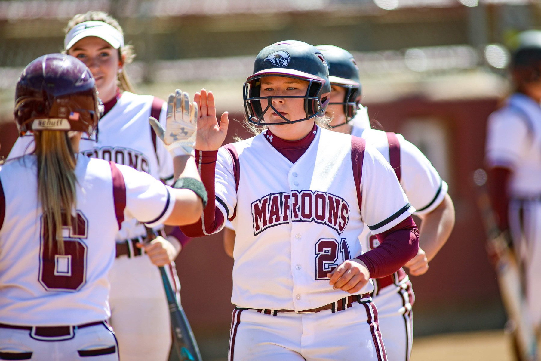 action photo of RC softball player Shanen Hester after a home run