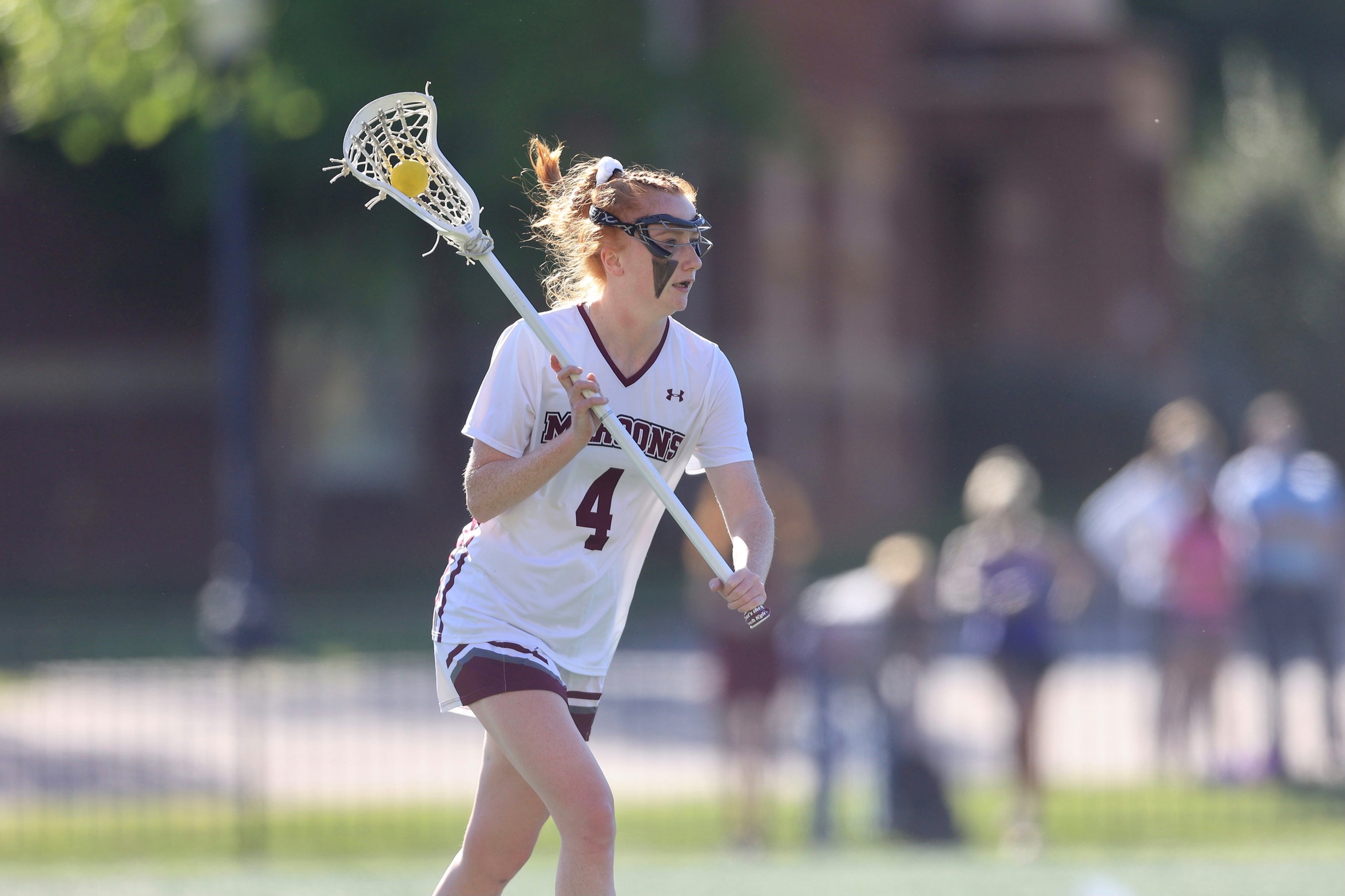 action photo of RC lacrosse player Molly Kasemeyer