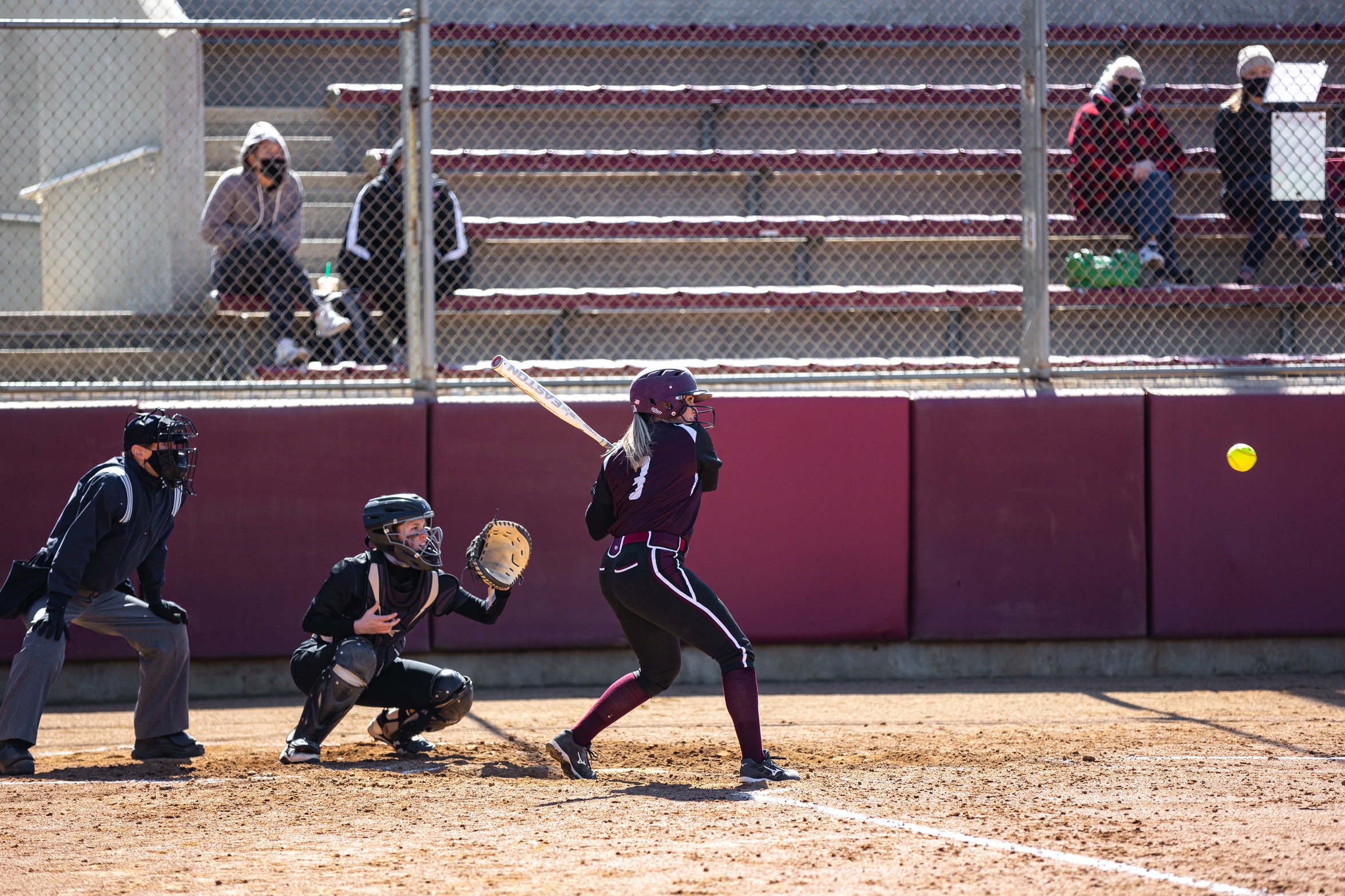 action photo of RC softball player Brooke Trapuzzano hitting