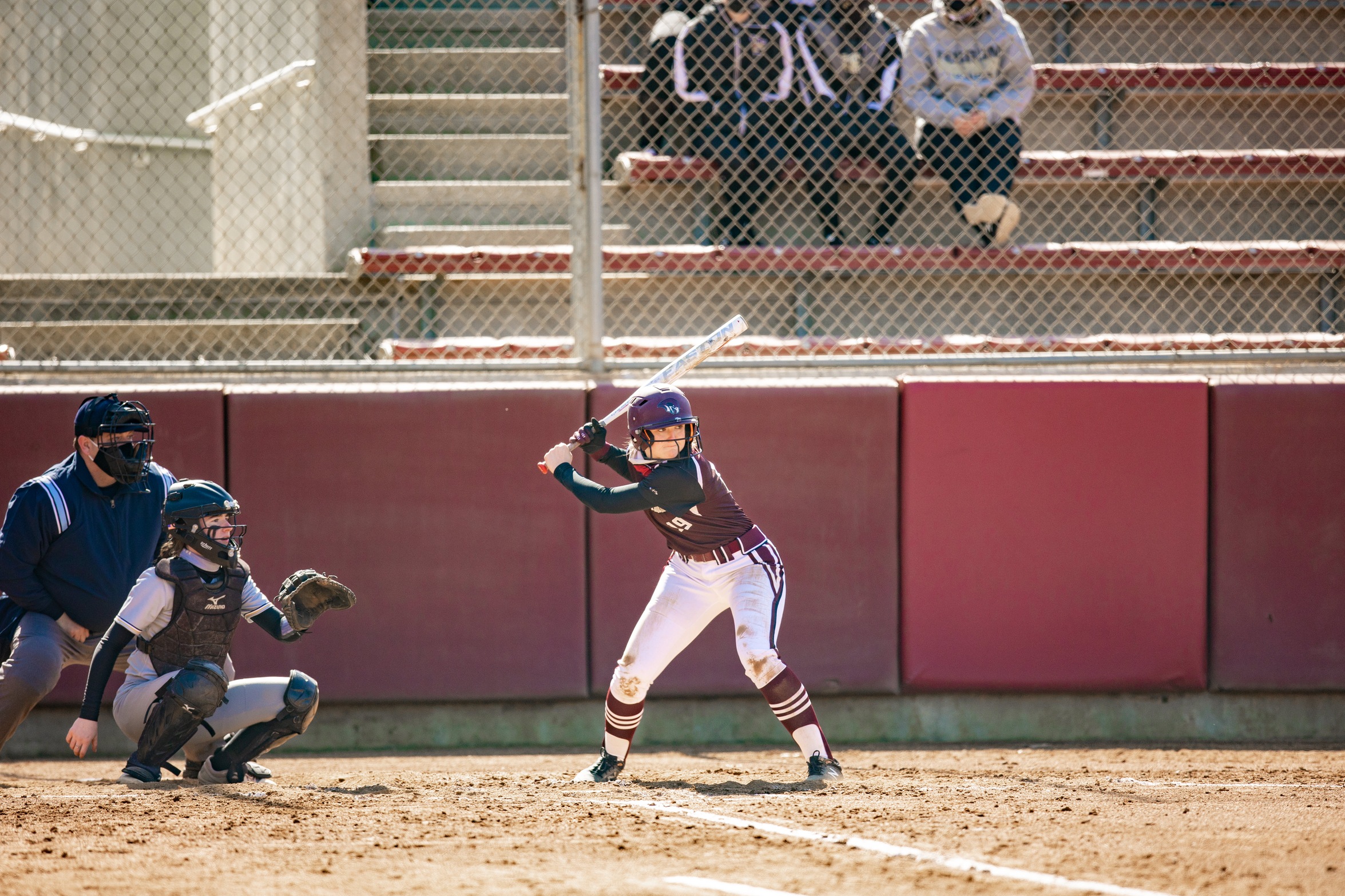 action photo of RC softball player Makayla Austin hitting