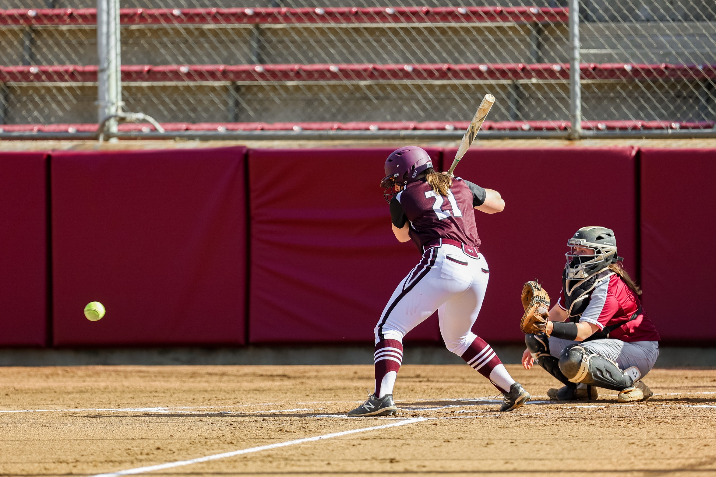 action photo of RC softball player Shanan Hester hitting
