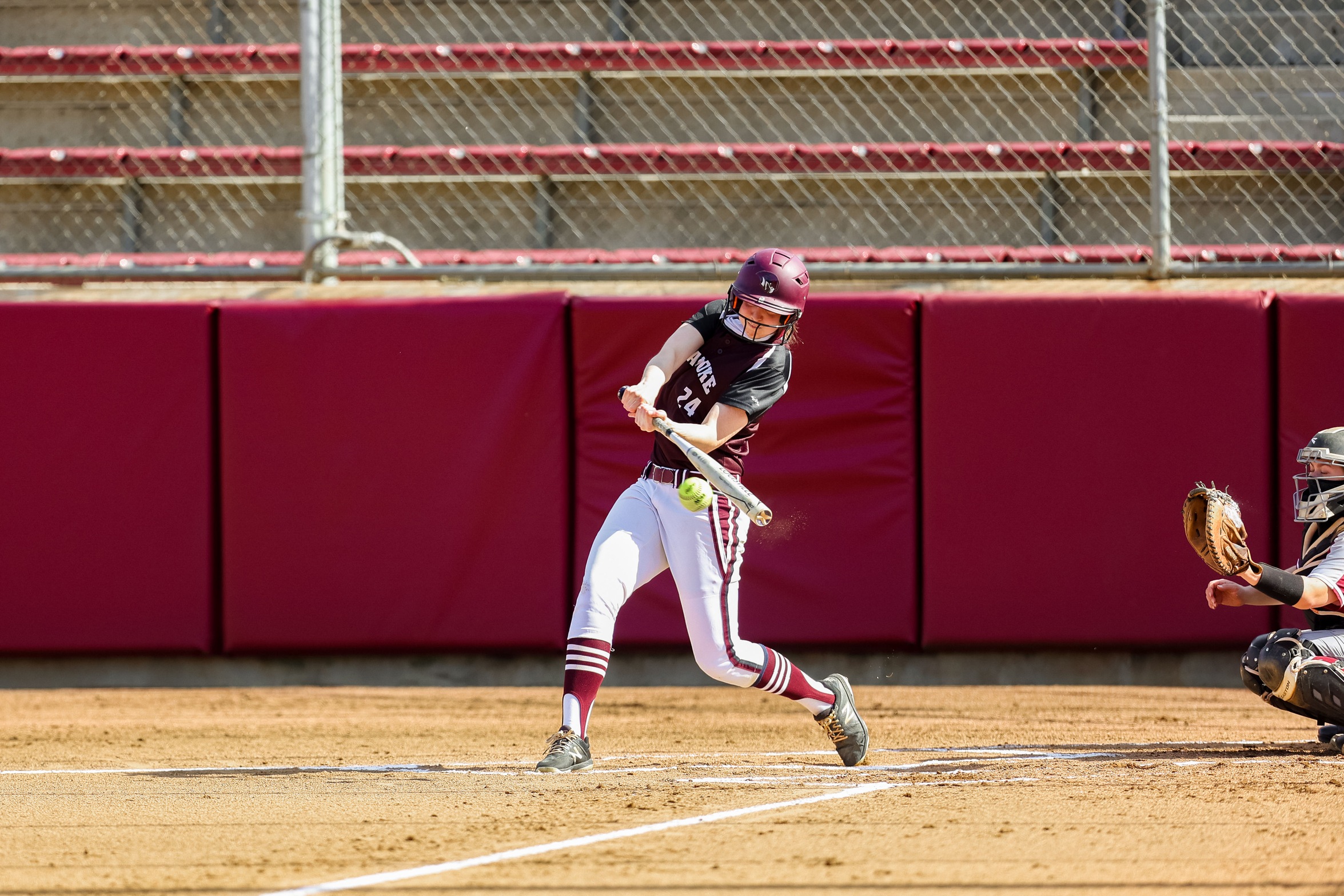 action photo of left handed RC softball hitter Rebecca Hensley
