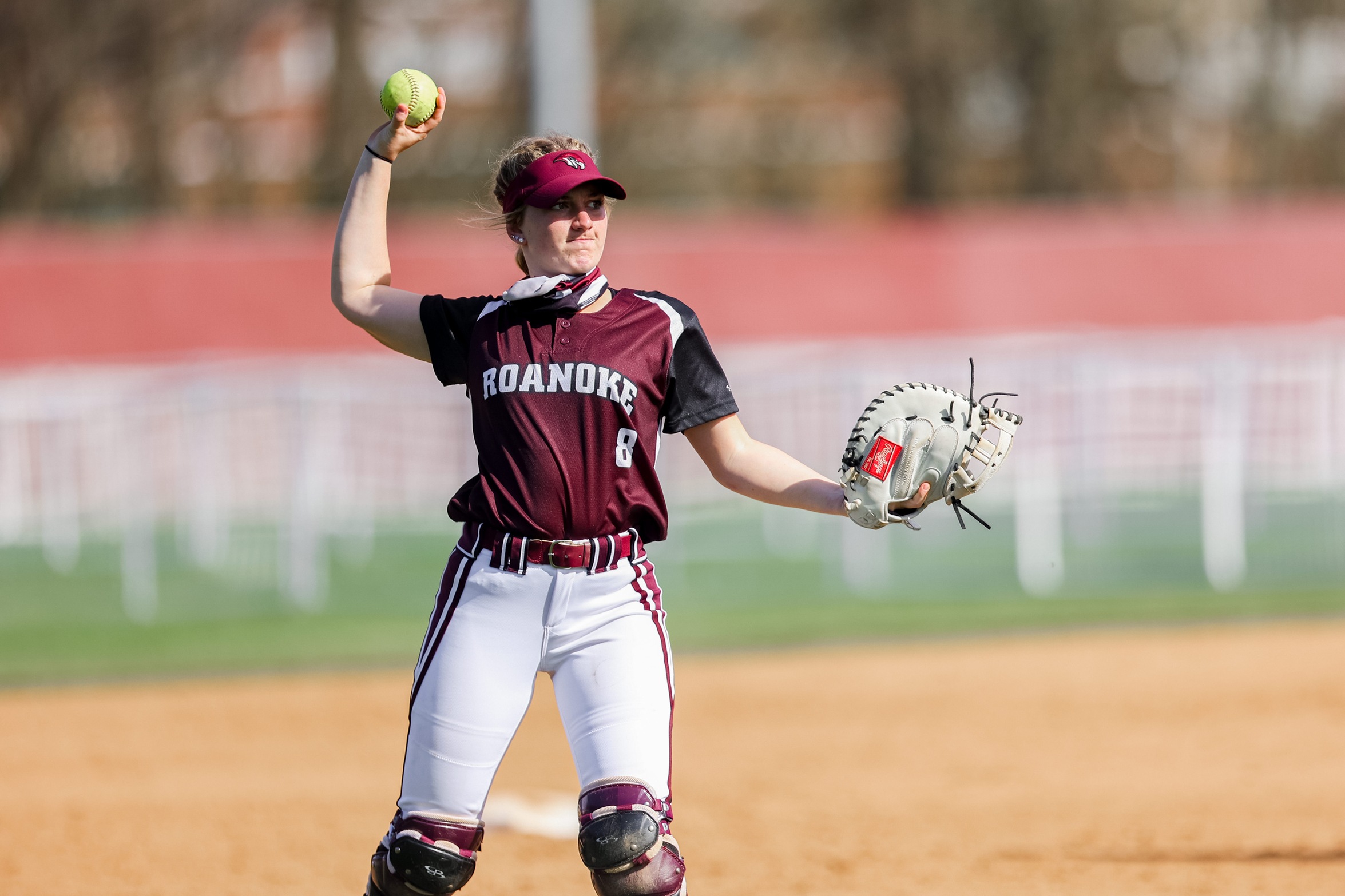 action photo of RC softball player Kate Houle throwing