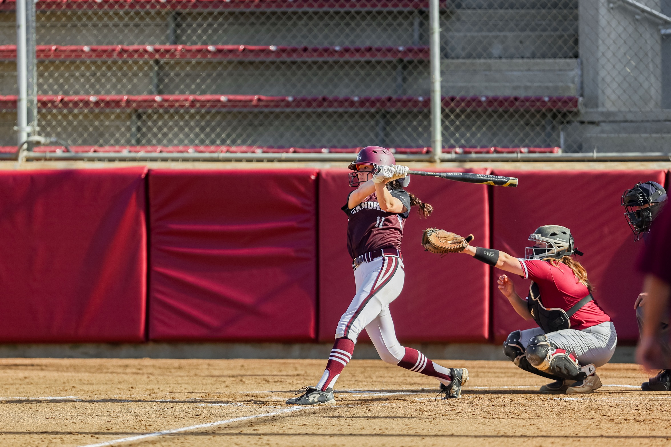 action photo of RC softball player Jada Karnes hitting