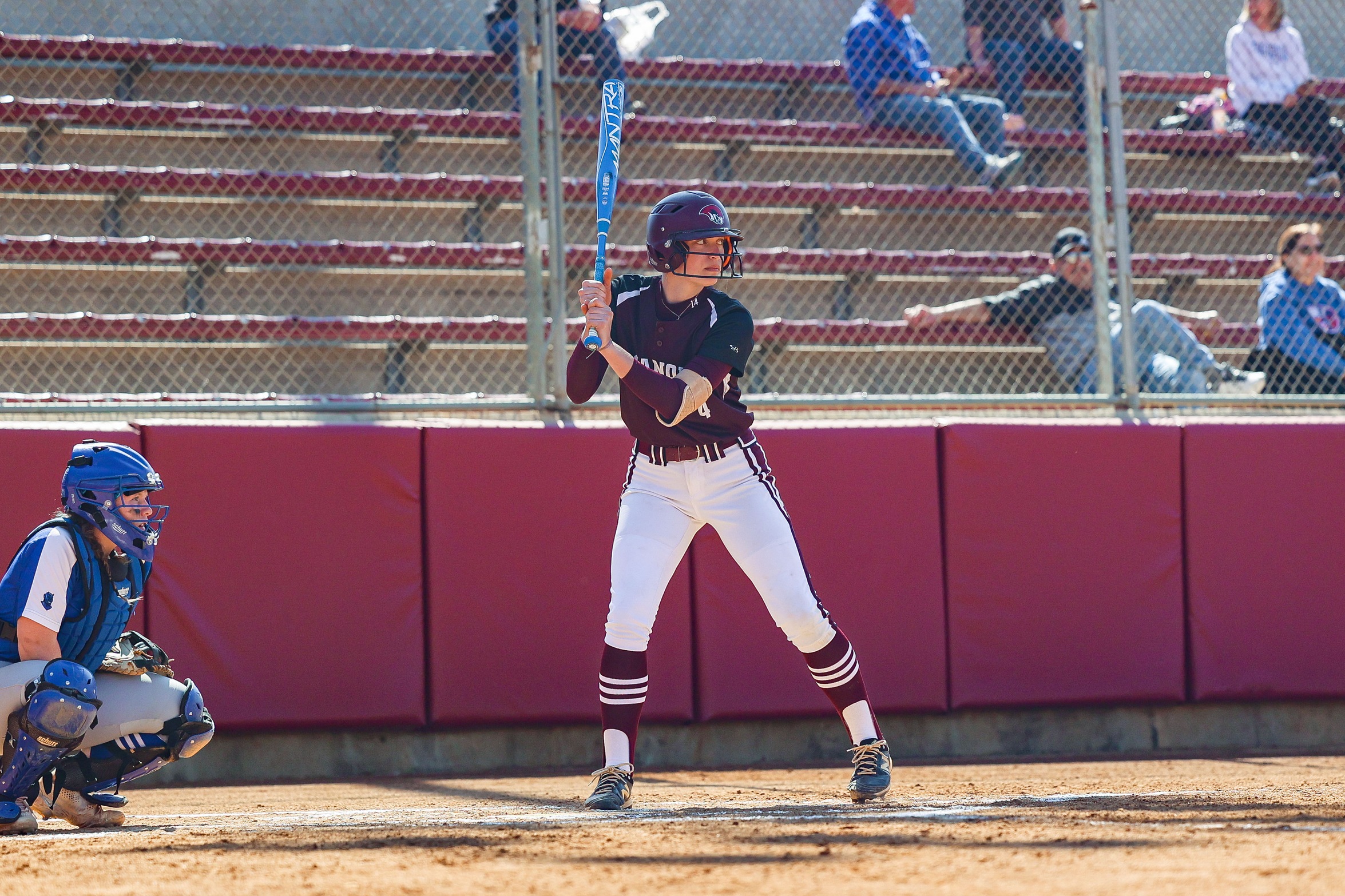 action photo of RC softball player hitting
