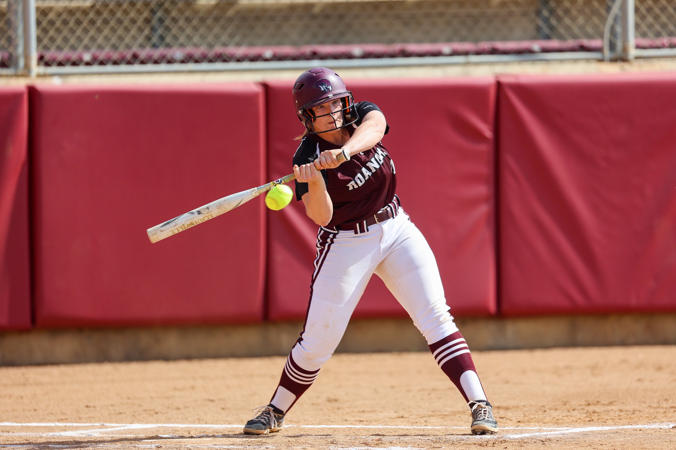 action phot of RC softball Shanan Hester hitting