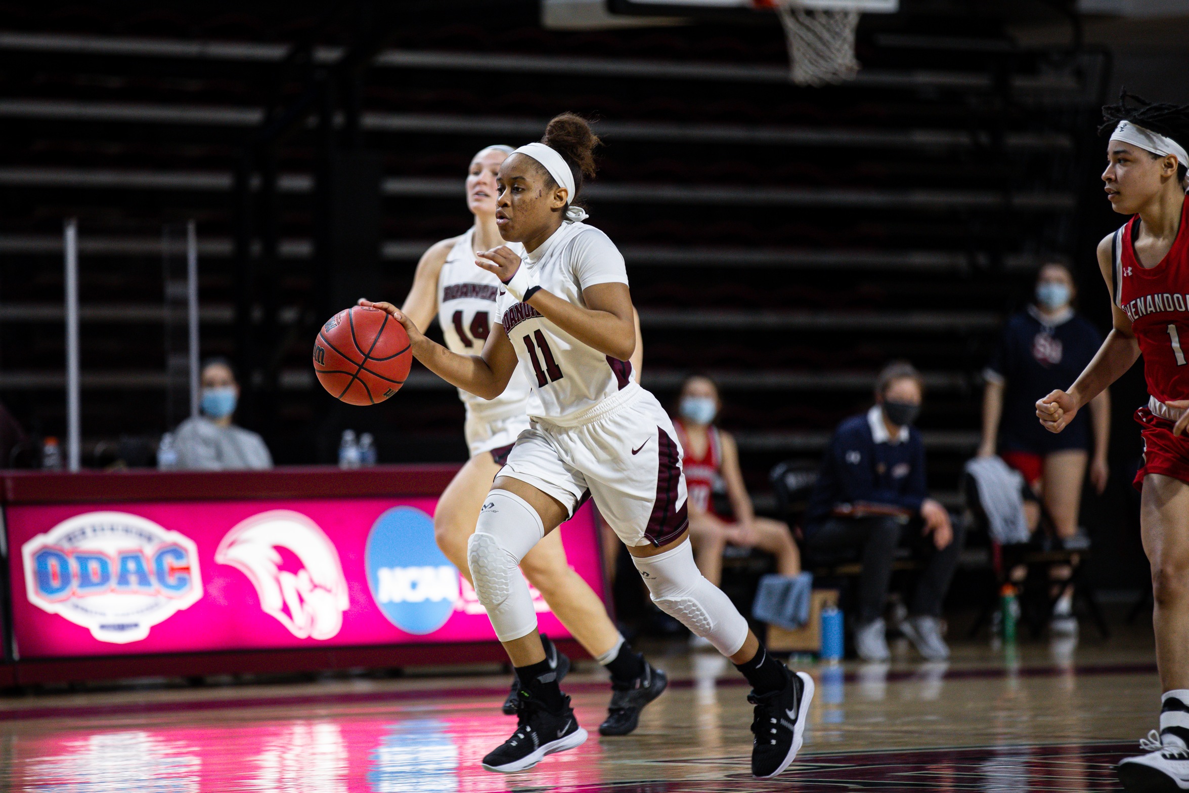 action photo of RC basketball player Whitney Hopson on the fast break