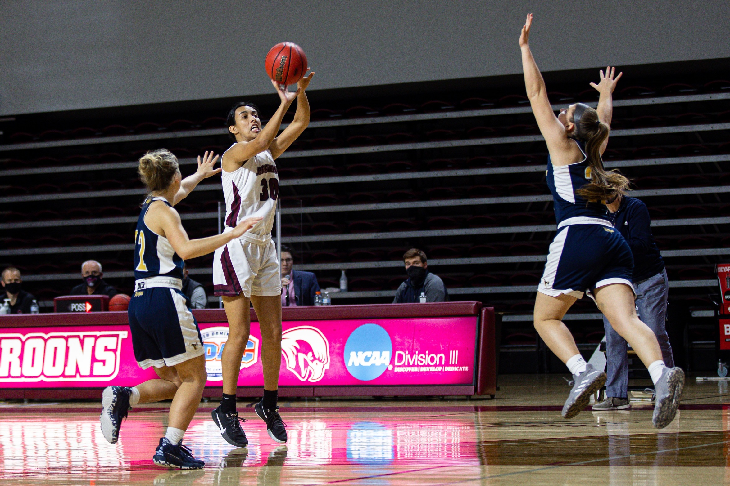 action photo of RC basketball player Renee Alquiza