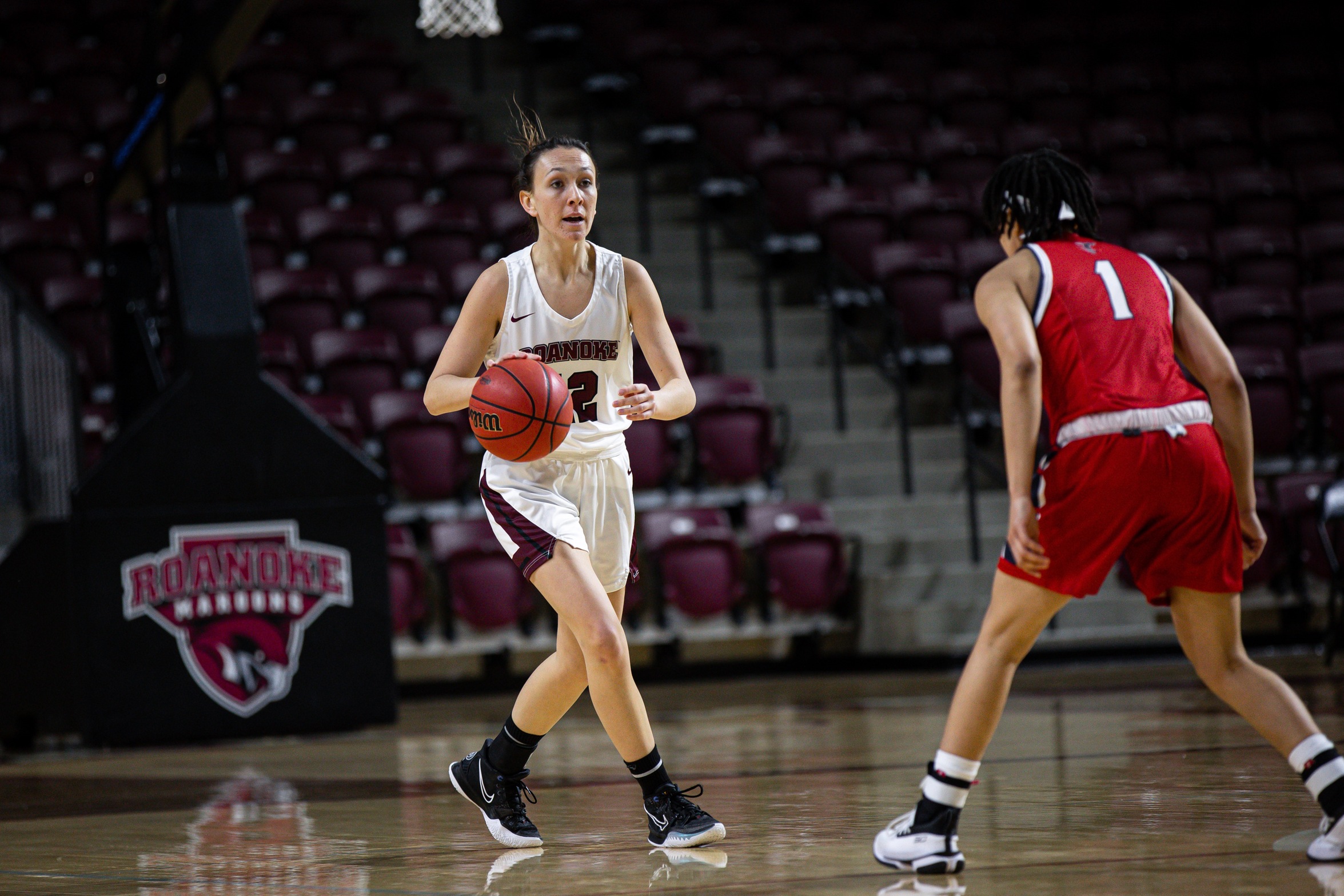 action photo of RC basketball player Kristina Harrel dribbling