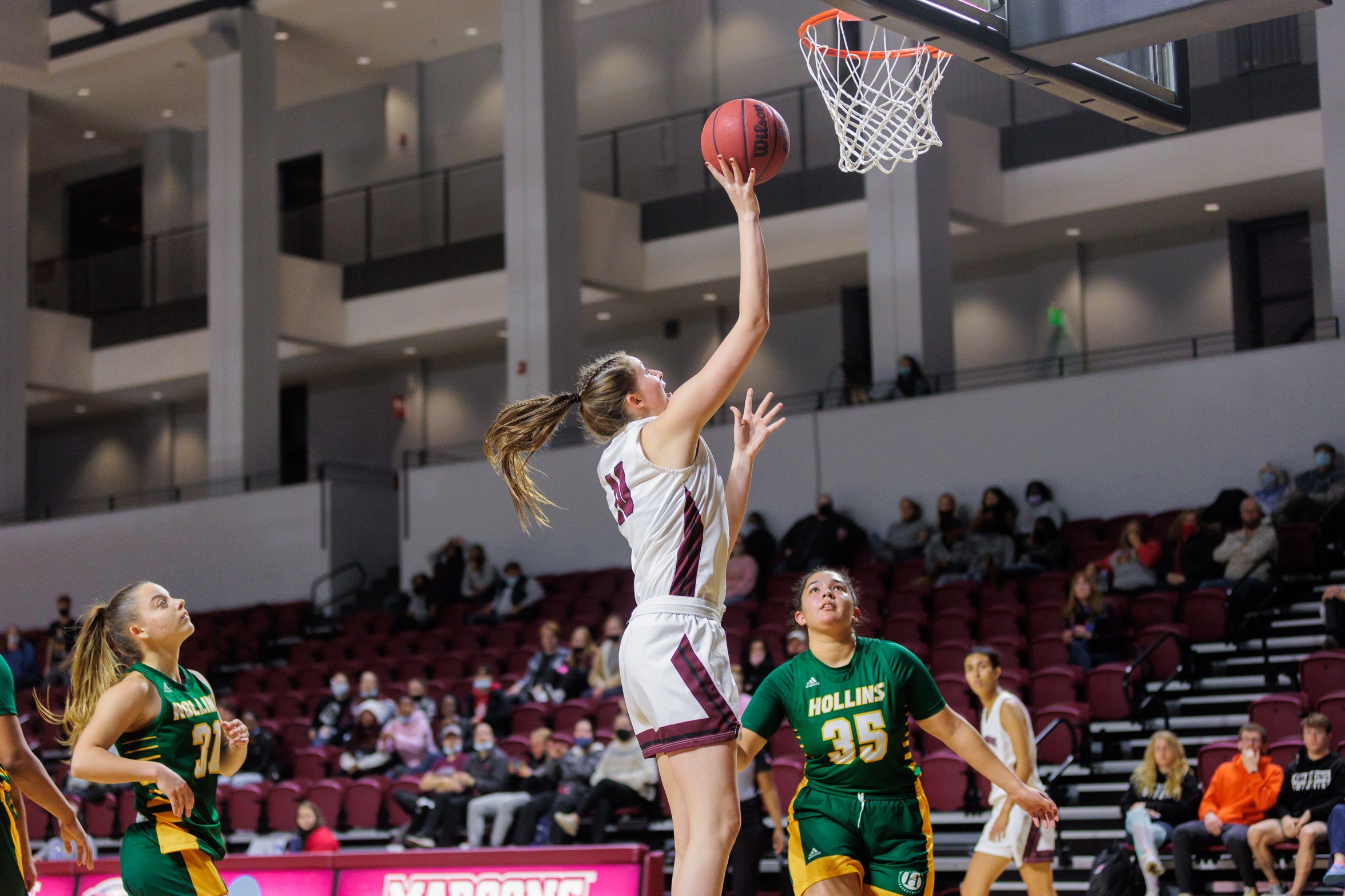 action photo of RC WBB Peyton Kirchner shooting a layup