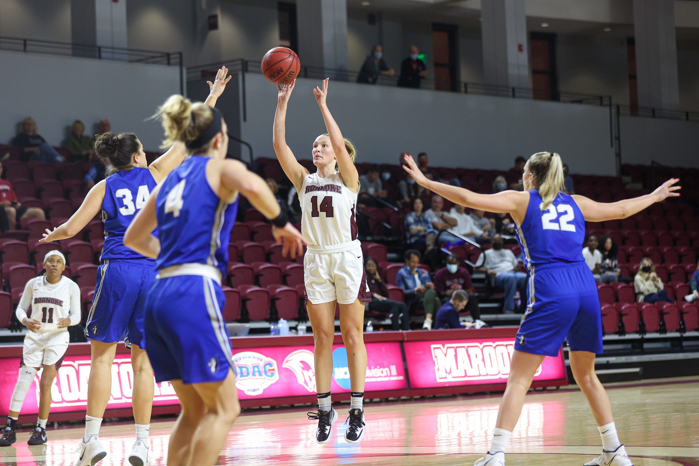 action phot of RC women's basketball player Morgan Micallef hitting a jump shot