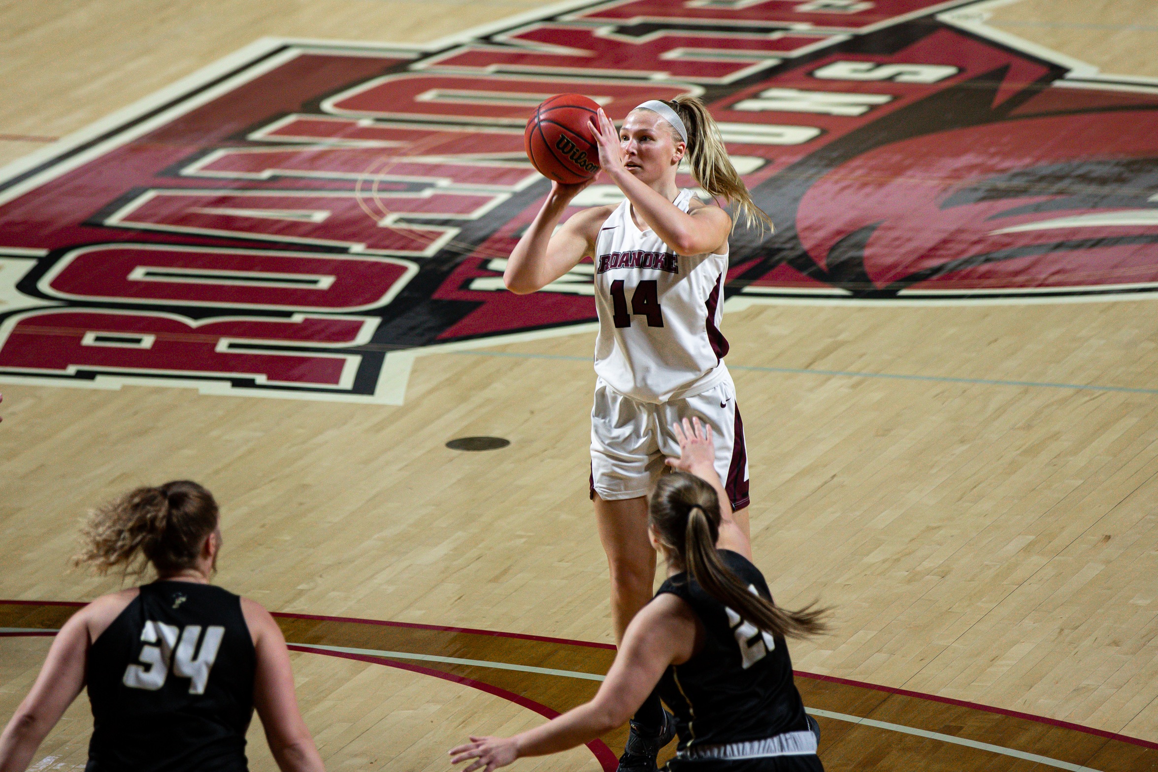 action photo of RC women's basketball player Morgan Micallef shooting a jump shot
