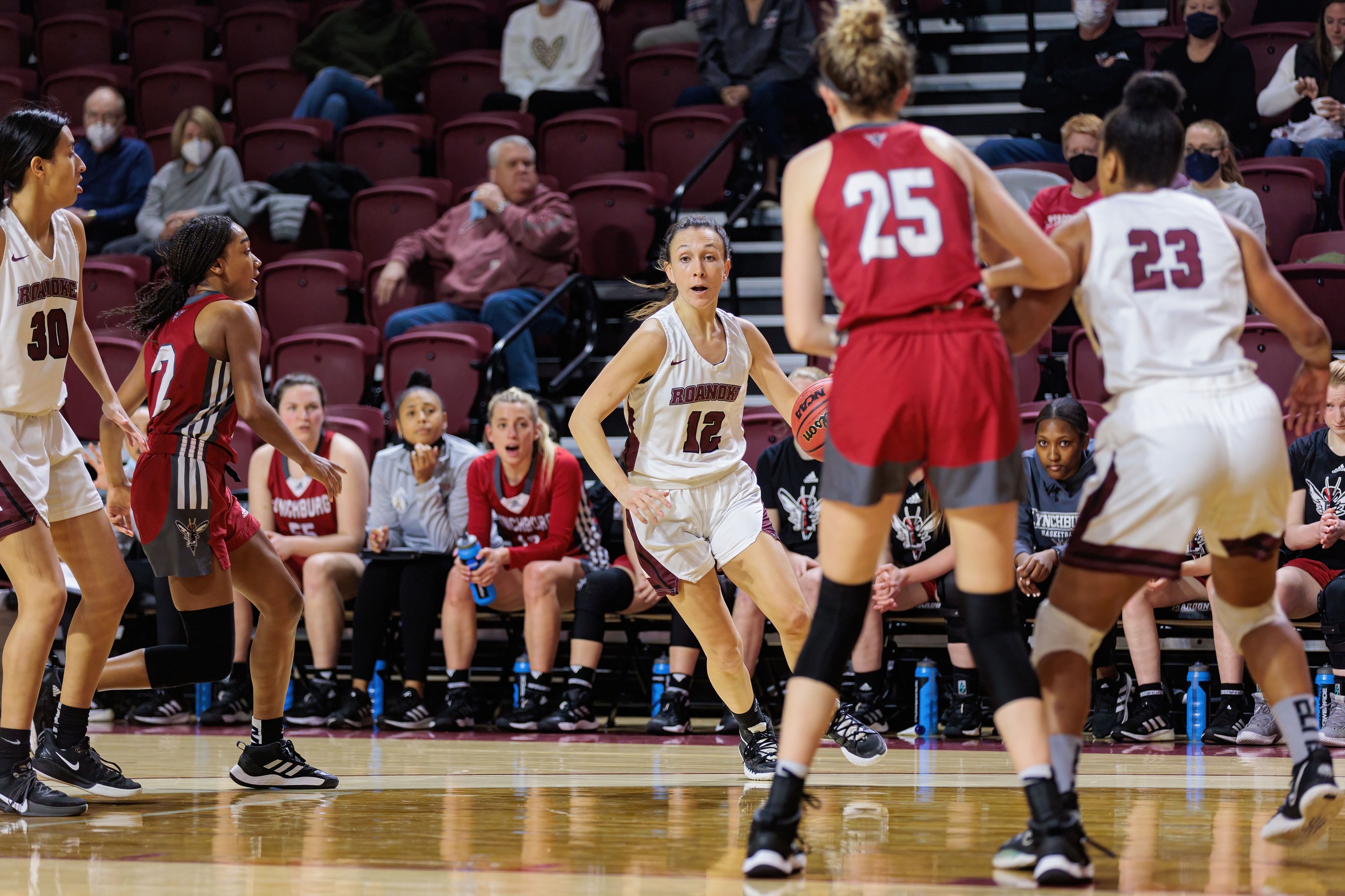 action photo of Roanoke basketball player Kristina Harrel driving into the lane
