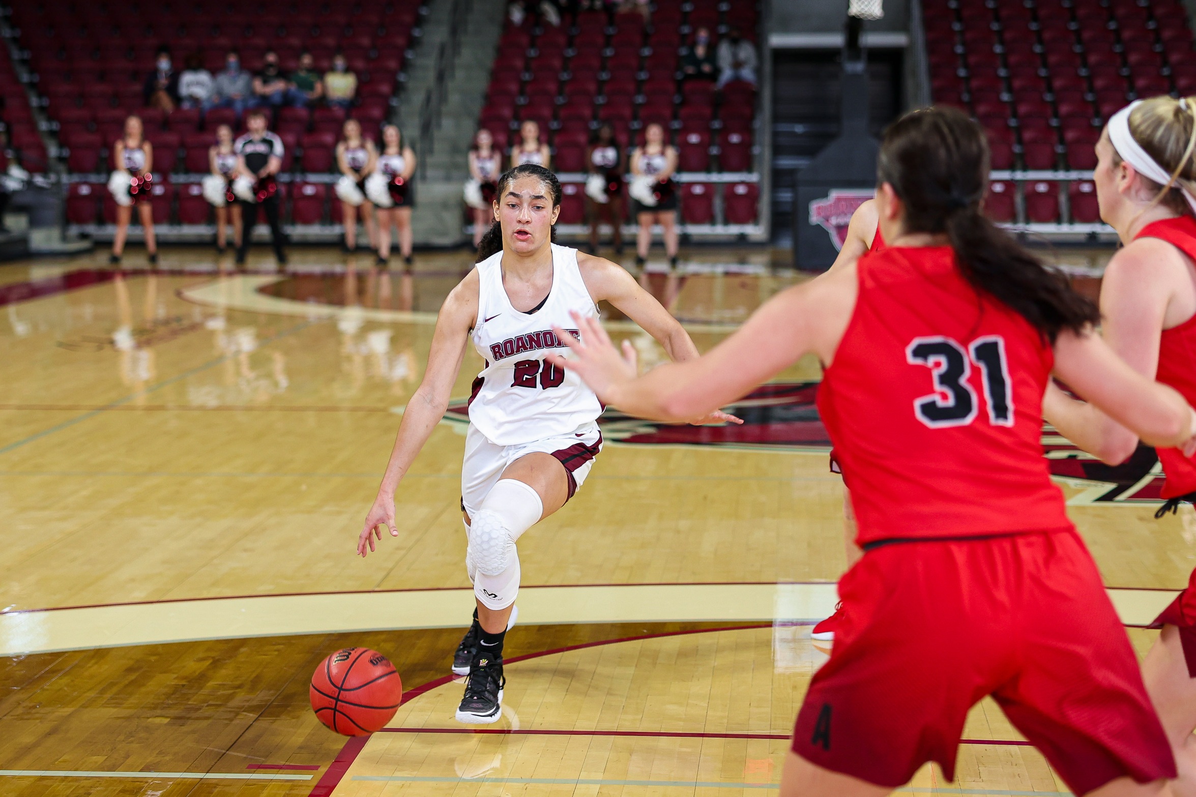 action photo of RC WBB JaBryah Haverkamp driving to the basket