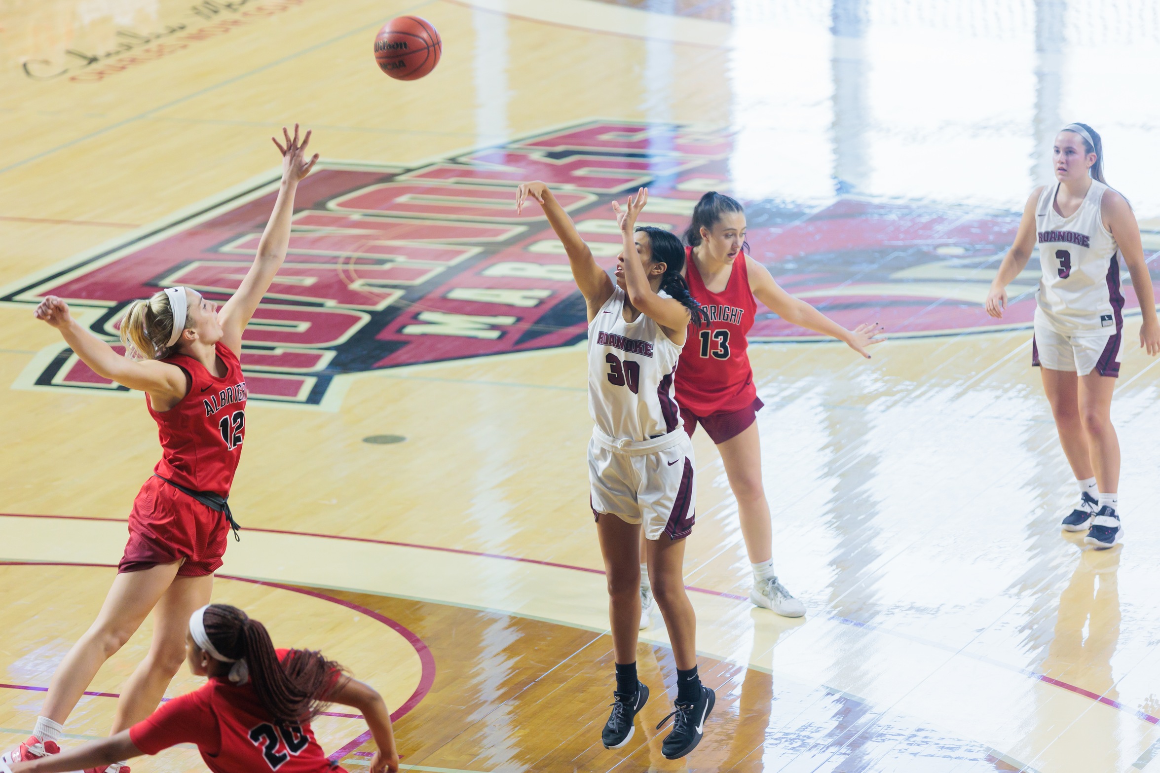 action photo of RC women's basketball player Renee Alquiza hitting a jump shot