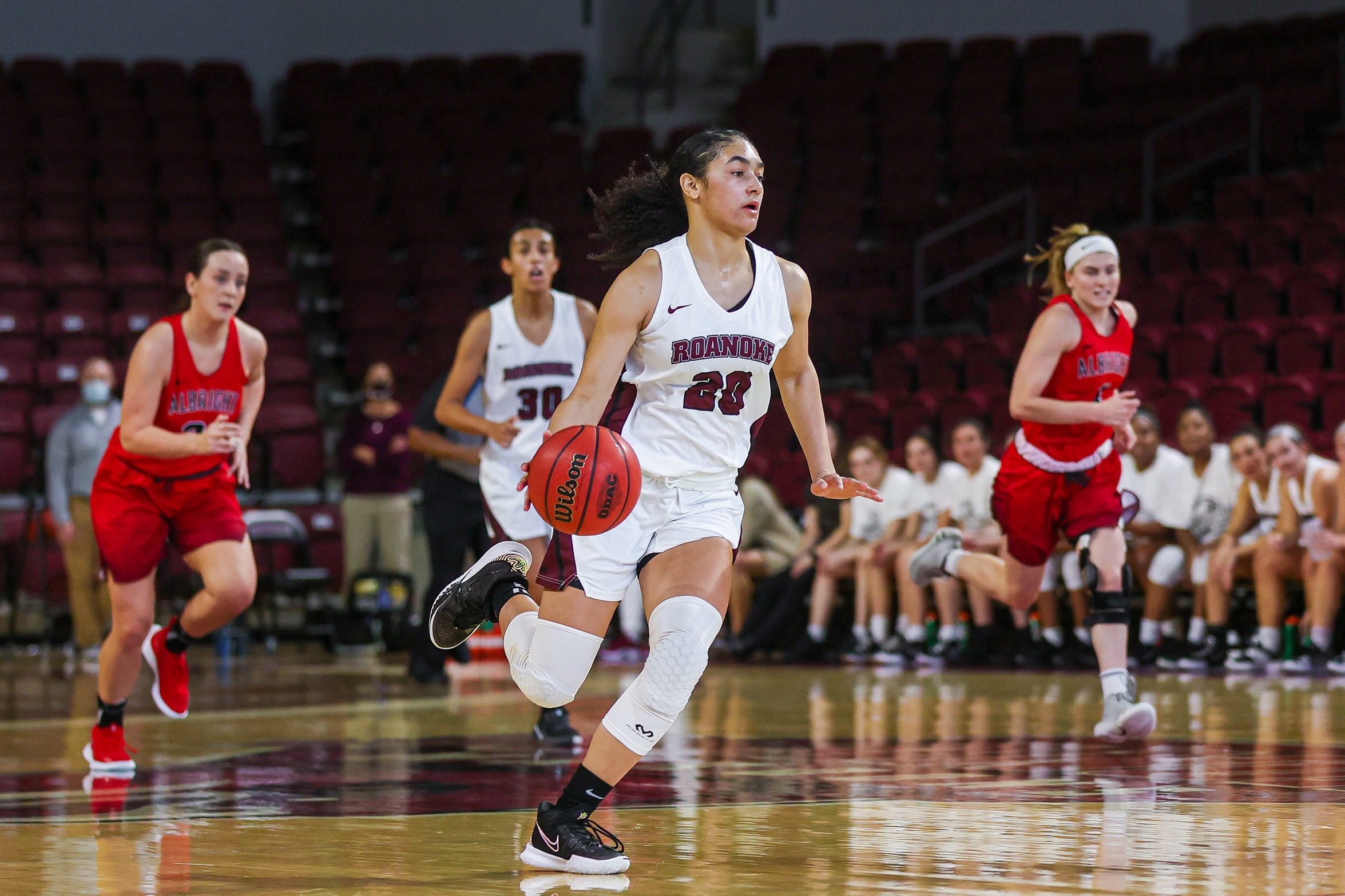 action photo of RC basketball player JaBryah Haverkamp dribbling up the floor